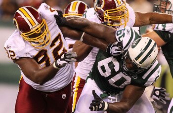 EAST RUTHERFORD, NJ - AUGUST 27:  Albert Haynesworth #92 of the Washington Redskins battles D'Brickashaw Ferguson #60 of the New York Jets during their preseason game on August 27, 2010 at the New Meadowlands Stadium  in East Rutherford, New Jersey.  (Pho