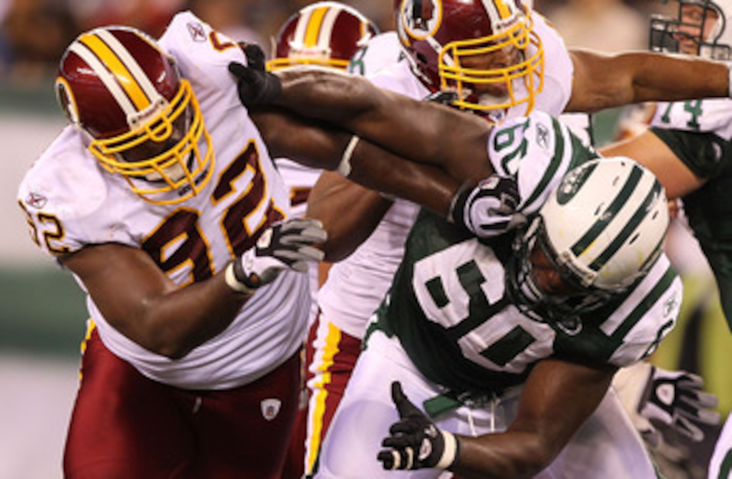 EAST RUTHERFORD, NJ - AUGUST 27:  Albert Haynesworth #92 of the Washington Redskins battles D'Brickashaw Ferguson #60 of the New York Jets during their preseason game on August 27, 2010 at the New Meadowlands Stadium  in East Rutherford, New Jersey.  (Pho