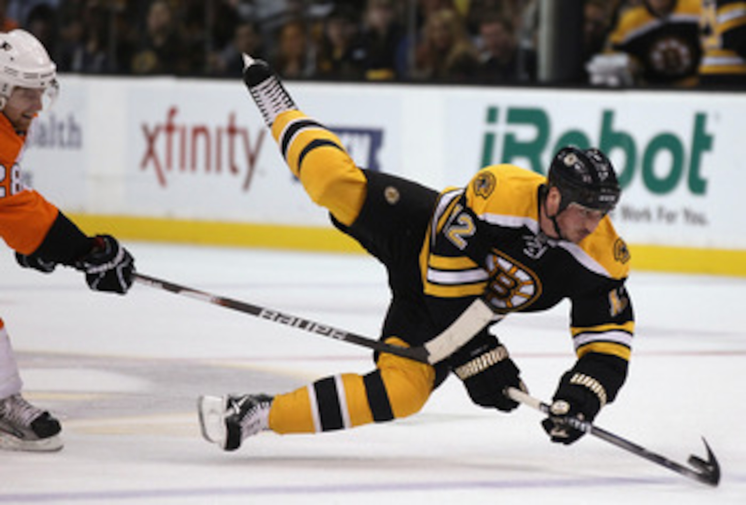 BOSTON, MA - MAY 06:  Tomas Kaberle #12 of the Boston Bruins is tripped by Claude Giroux #28 of the Philadelphia Flyers in Game Four of the Eastern Conference Semifinals during the 2011 NHL Stanley Cup Playoffs at TD Garden on May 6, 2011 in Boston, Massa