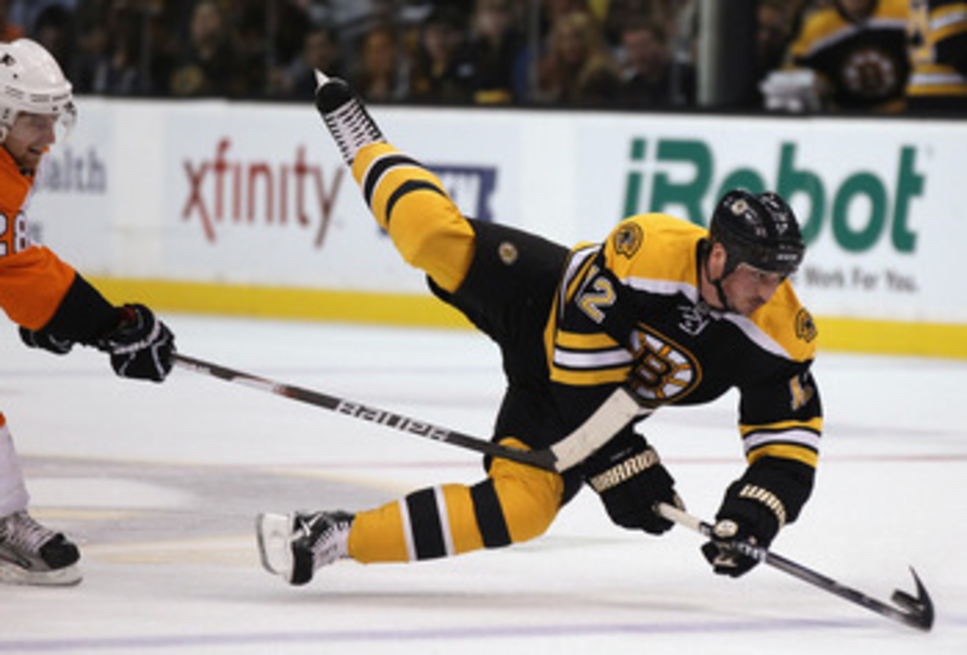 BOSTON, MA - MAY 06:  Tomas Kaberle #12 of the Boston Bruins is tripped by Claude Giroux #28 of the Philadelphia Flyers in Game Four of the Eastern Conference Semifinals during the 2011 NHL Stanley Cup Playoffs at TD Garden on May 6, 2011 in Boston, Massa