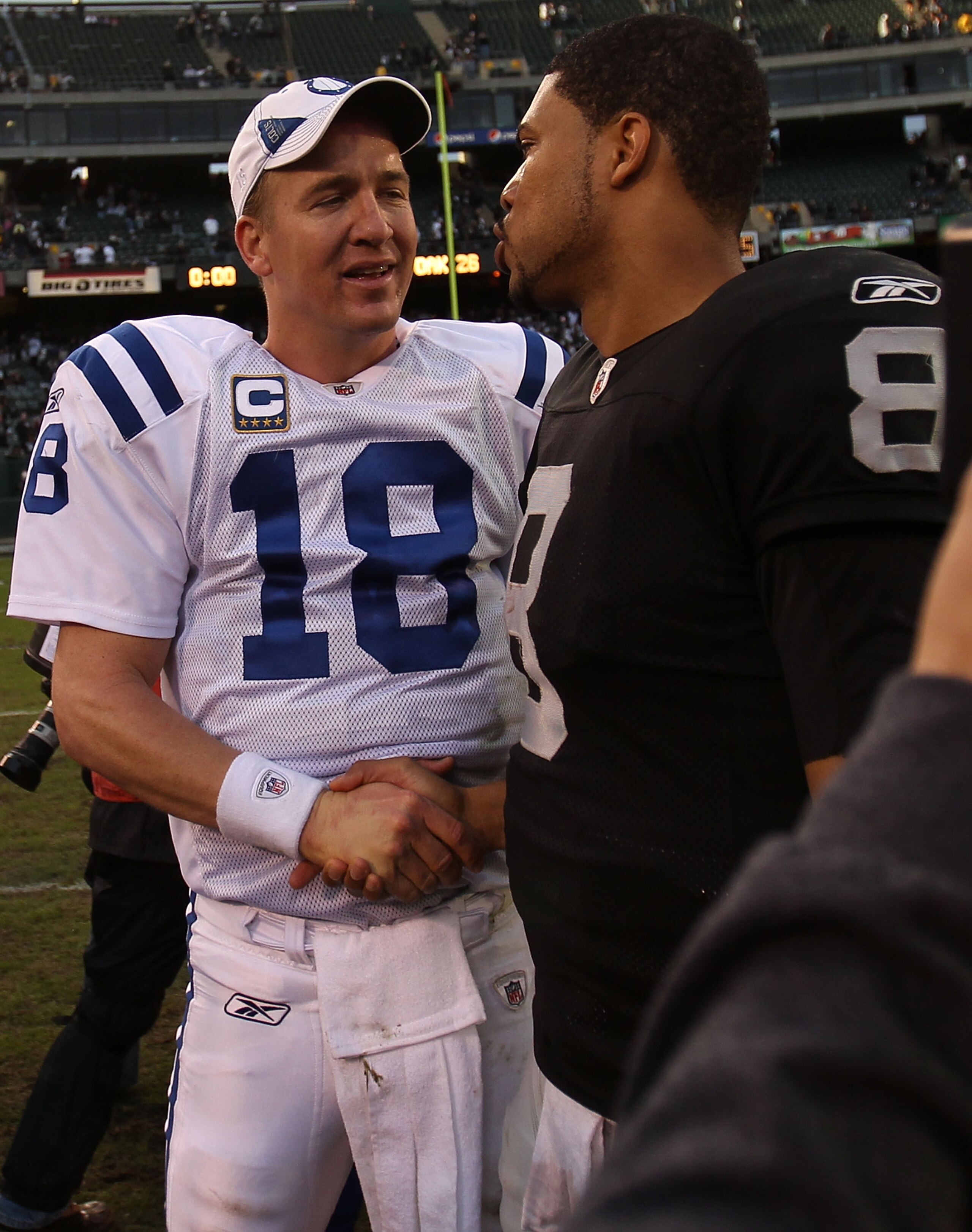 OAKLAND, CA - DECEMBER 26: Peyton Manning #18 of the Indianapolis Colts shakes hands with Jason Campbell #8 of the Oakland Raiders during an NFL game at Oakland-Alameda County Coliseum on December 26, 2010 in Oakland, California. (Photo by Jed Jacobso OAKLAND, CA - DECEMBER 26: Peyton Manning #18 of the Indianapolis Colts shakes hands with Jason Campbell #8 of the Oakland Raiders during an NFL game at Oakland-Alameda County Coliseum on December 26, 2010 in Oakland, California. (Photo by Jed Jacobso