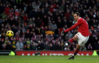 MANCHESTER, ENGLAND - NOVEMBER 27:  Dimitar Berbatov of Manchester United scores his team's third goal during the Barclays Premier League match between Manchester United and Blackburn Rovers at Old Trafford on November 27, 2010 in Manchester, England.  (P