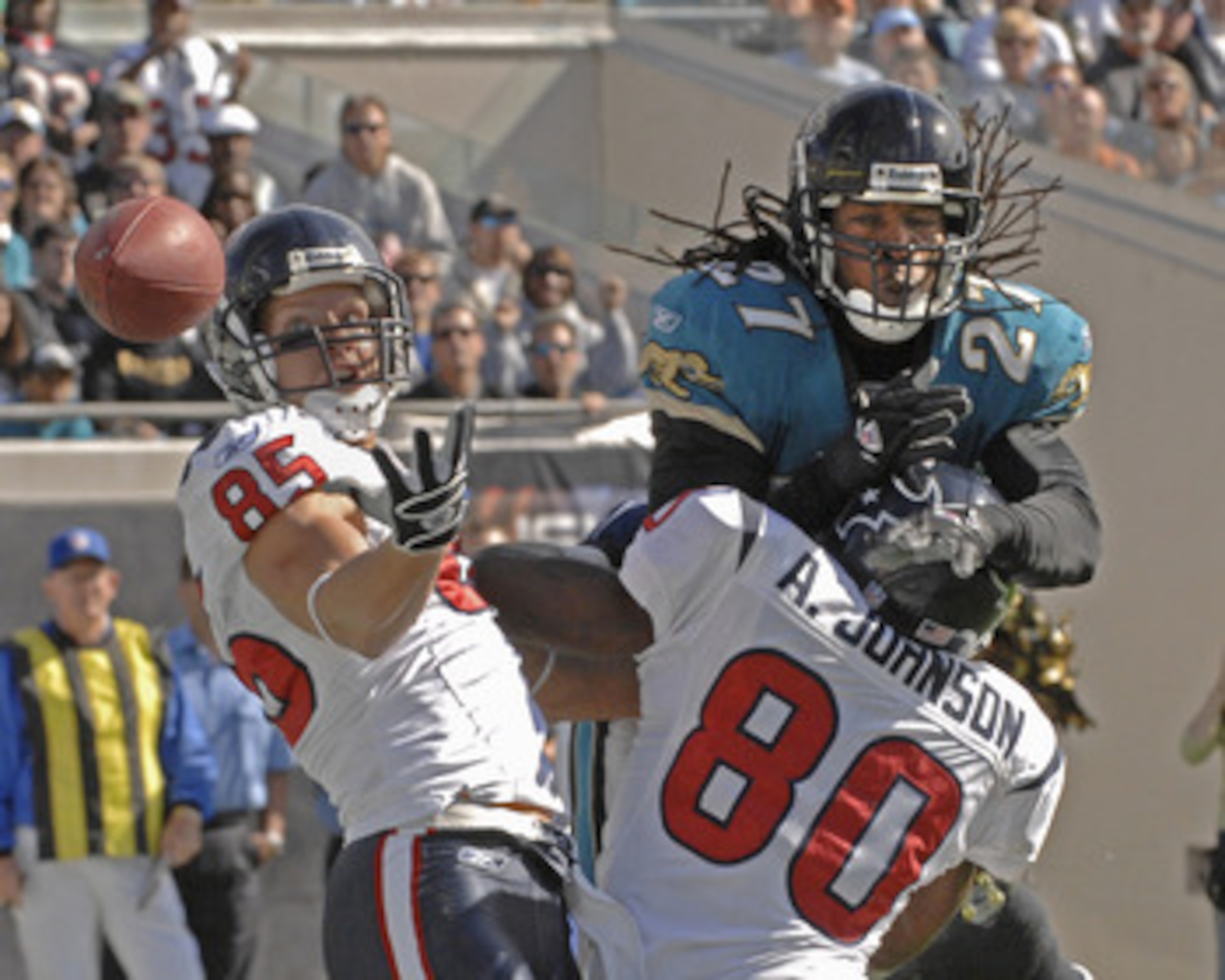 Jacksonville Jaguars cornerback Rashean Mathis defends an end zone pass against Houston Texans receiver Andre Johnson (80) and Kevin Walter (85) at Alltel Stadium in Jacksonville, Florida on November 12, 2006. The Texans won 13 - 10.  (Photo by Al Messers