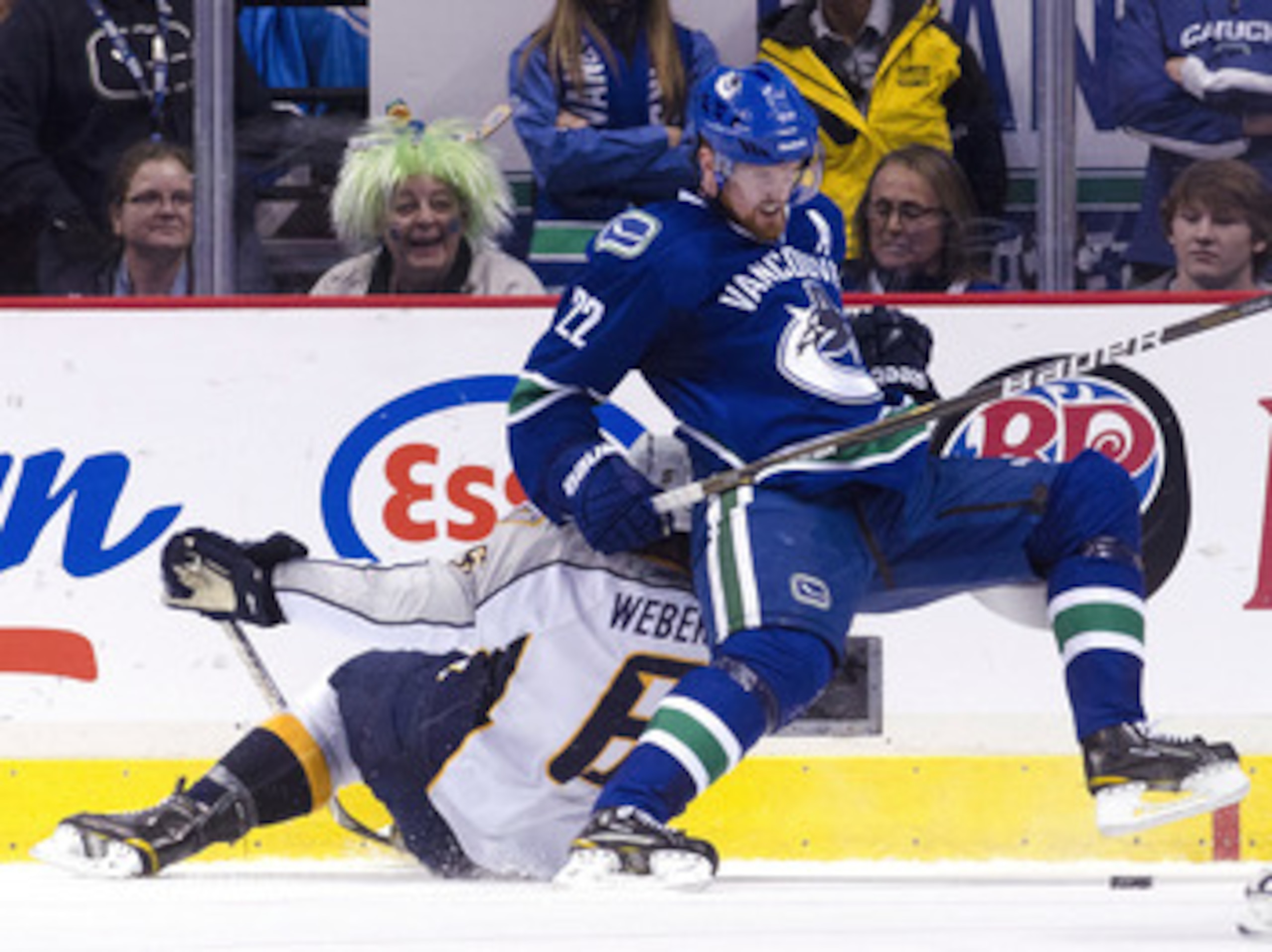 VANCOUVER, CANADA - MAY 7: Daniel Sedin #22 of the Vancouver Canucks gets hauled down by Shea Weber #6 of the Nashville Predators during the second period in Game Five of the Western Conference Semifinals during the 2011 NHL Stanley Cup Playoffs on May 07