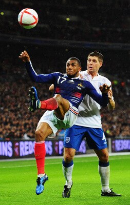 LONDON, ENGLAND - NOVEMBER 17: Steven Gerrard of England is beaten to the ball by Yann M'Vila of France during the international friendly match between England and France at Wembley Stadium on November 17, 2010 in London, England. (Photo by Mike Hewitt/ LONDON, ENGLAND - NOVEMBER 17: Steven Gerrard of England is beaten to the ball by Yann M'Vila of France during the international friendly match between England and France at Wembley Stadium on November 17, 2010 in London, England. (Photo by Mike Hewitt/
