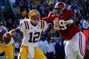 BATON ROUGE, LA - NOVEMBER 06:  Quarterback Jarrett Lee #12 of the Louisiana State University Tigers is sacked by Josh Chapman #99 of the Alabama Crimson Tide  at Tiger Stadium on November 6, 2010 in Baton Rouge, Louisiana.  (Photo by Chris Graythen/Getty