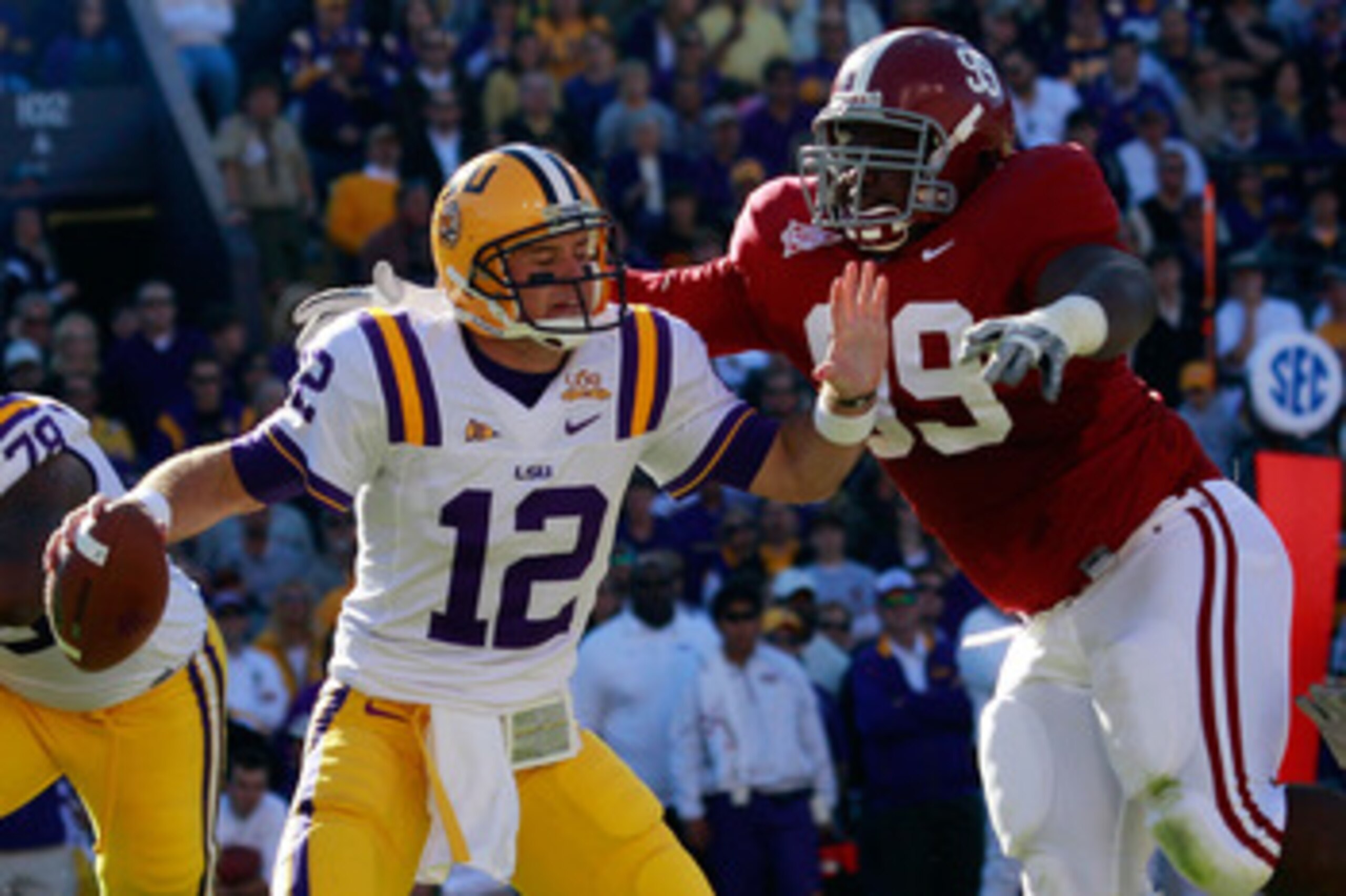 BATON ROUGE, LA - NOVEMBER 06:  Quarterback Jarrett Lee #12 of the Louisiana State University Tigers is sacked by Josh Chapman #99 of the Alabama Crimson Tide  at Tiger Stadium on November 6, 2010 in Baton Rouge, Louisiana.  (Photo by Chris Graythen/Getty