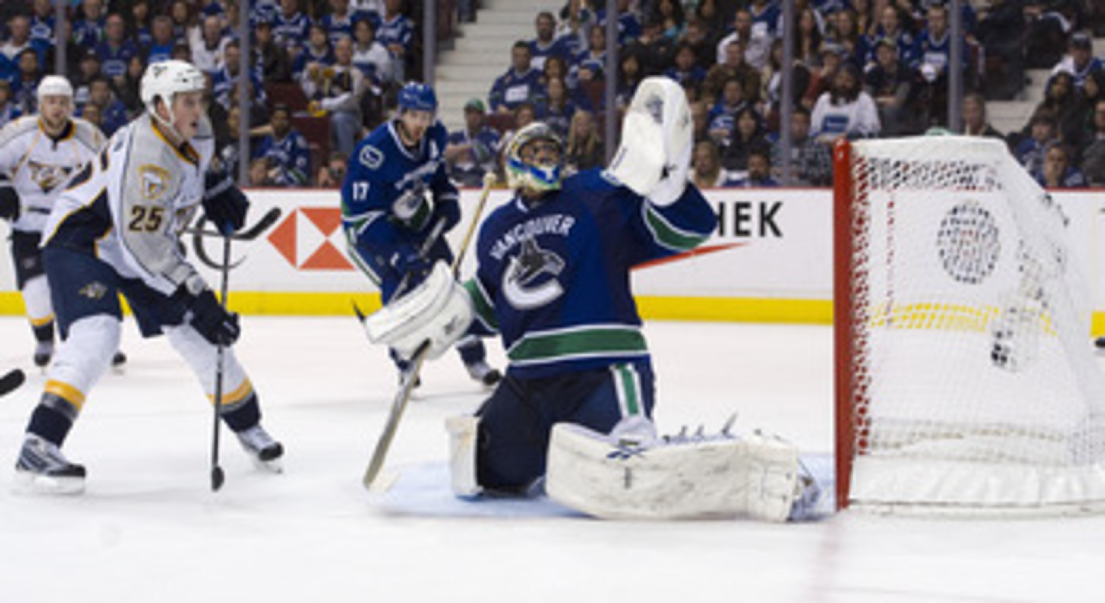 VANCOUVER, CANADA - APRIL 30: Jerred Smithson #25 of the Nashville Predators and Ryan Kesler #17 of the Vancouver Canucks watches the puck shot by Matt Halischuck #24 (not pictured) of the Nashville Predators hit the back of the net after getting past goa