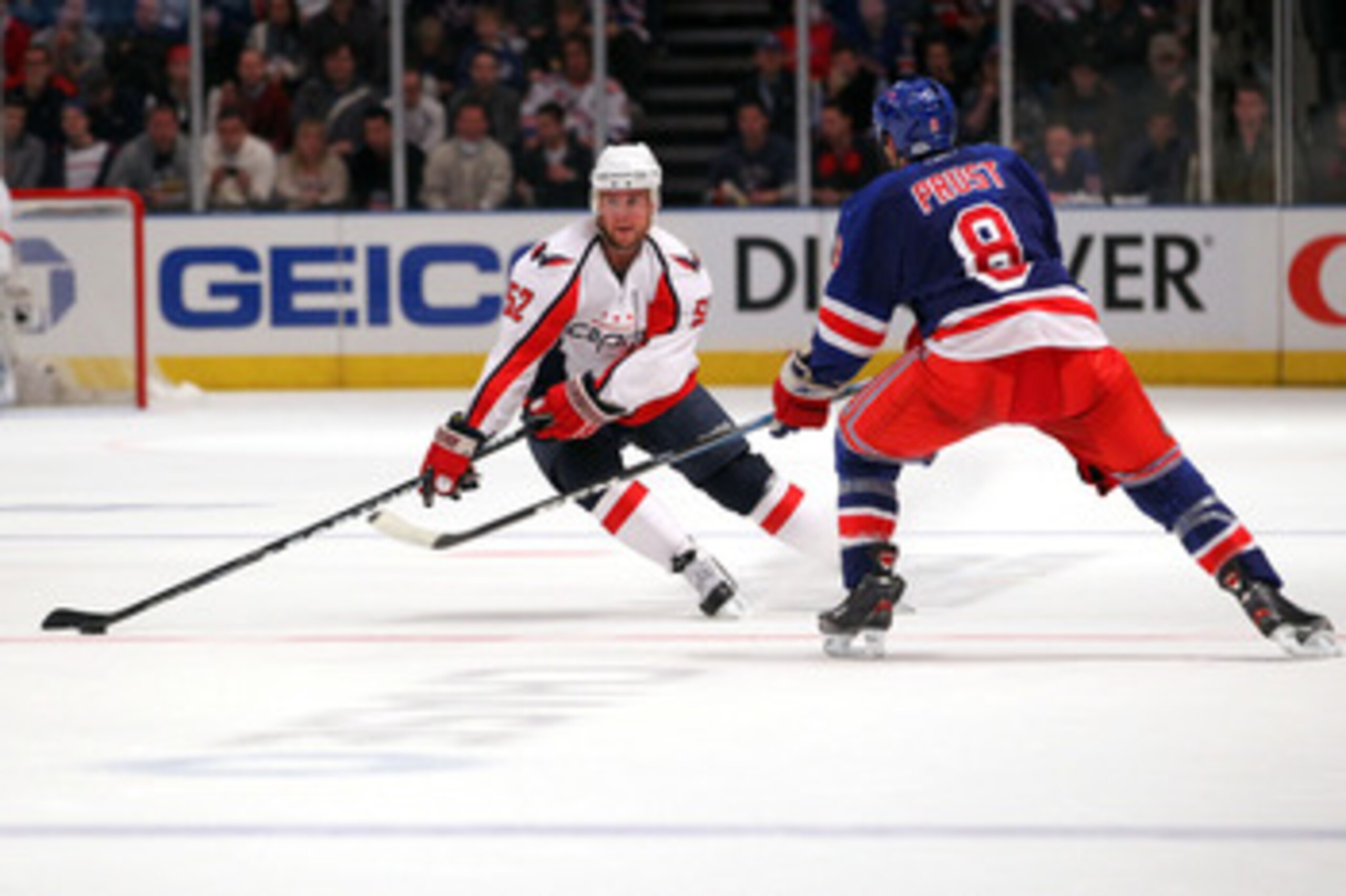 NEW YORK, NY - APRIL 17:  Mike Green #52 of the Washington Capitals skates against Brandon Prust #8 of the New York Rangers in Game Three of the Eastern Conference Quarterfinals during the 2011 NHL Stanley Cup Playoffs at Madison Square Garden on April 17