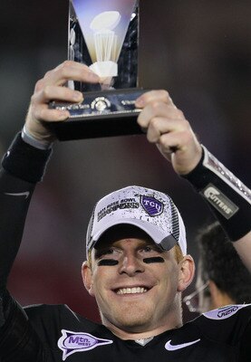 PASADENA, CA - JANUARY 01:  Quarterback Andy Dalton #14 of the TCU Horned Frogs holds the offensive player of the game trophy after defeating the Wisconsin Badgers 21-19 in the 97th Rose Bowl game on January 1, 2011 in Pasadena, California.  (Photo by Ste