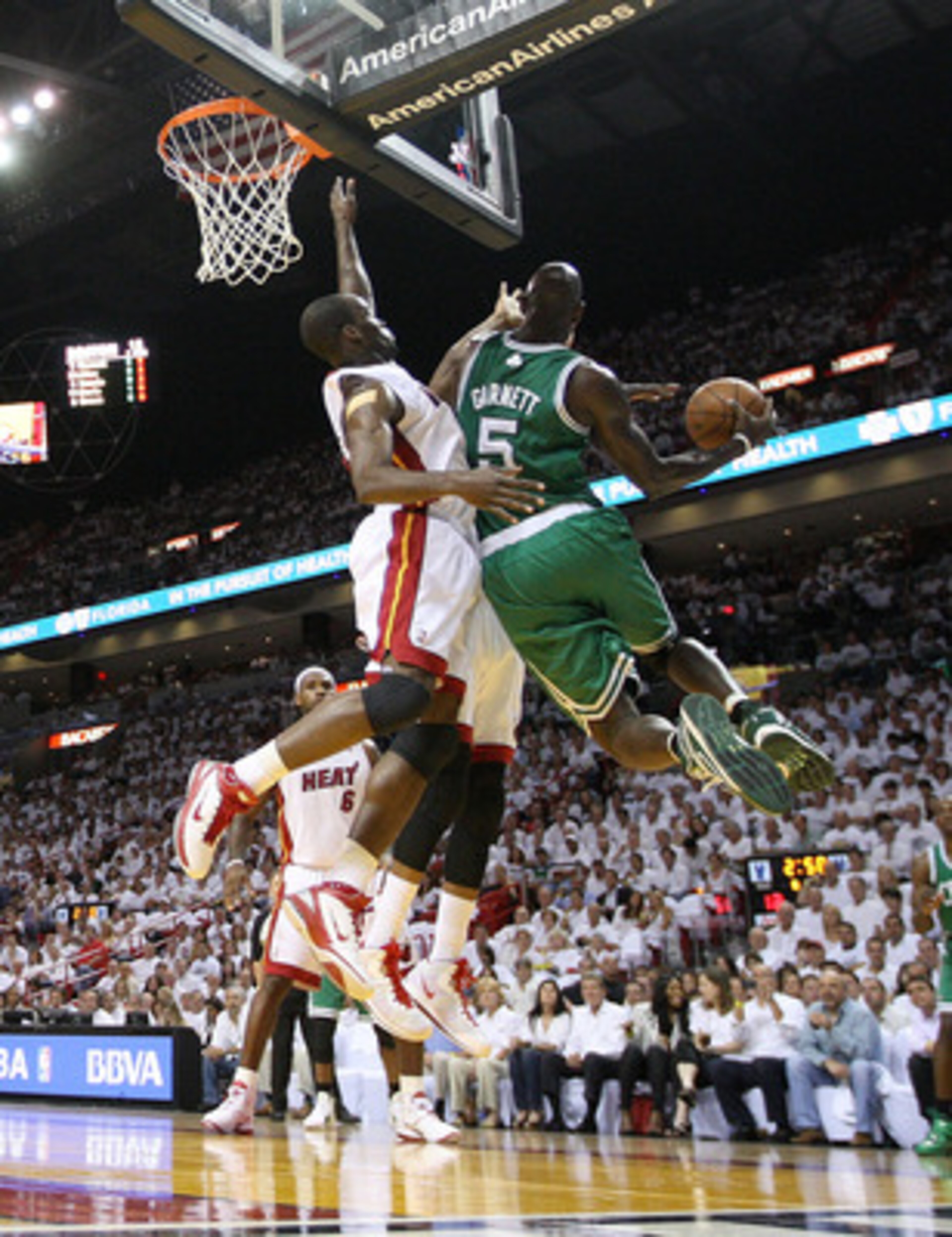 MIAMI, FL - MAY 11:  Kevin Garnett #5 of the Boston Celtics drives against Joel Anthony #50 of the Miami Heat during Game Five of the Eastern Conference Semifinals of the 2011 NBA Playoffs at American Airlines Arena on May 11, 2011 in Miami, Florida. NOTE