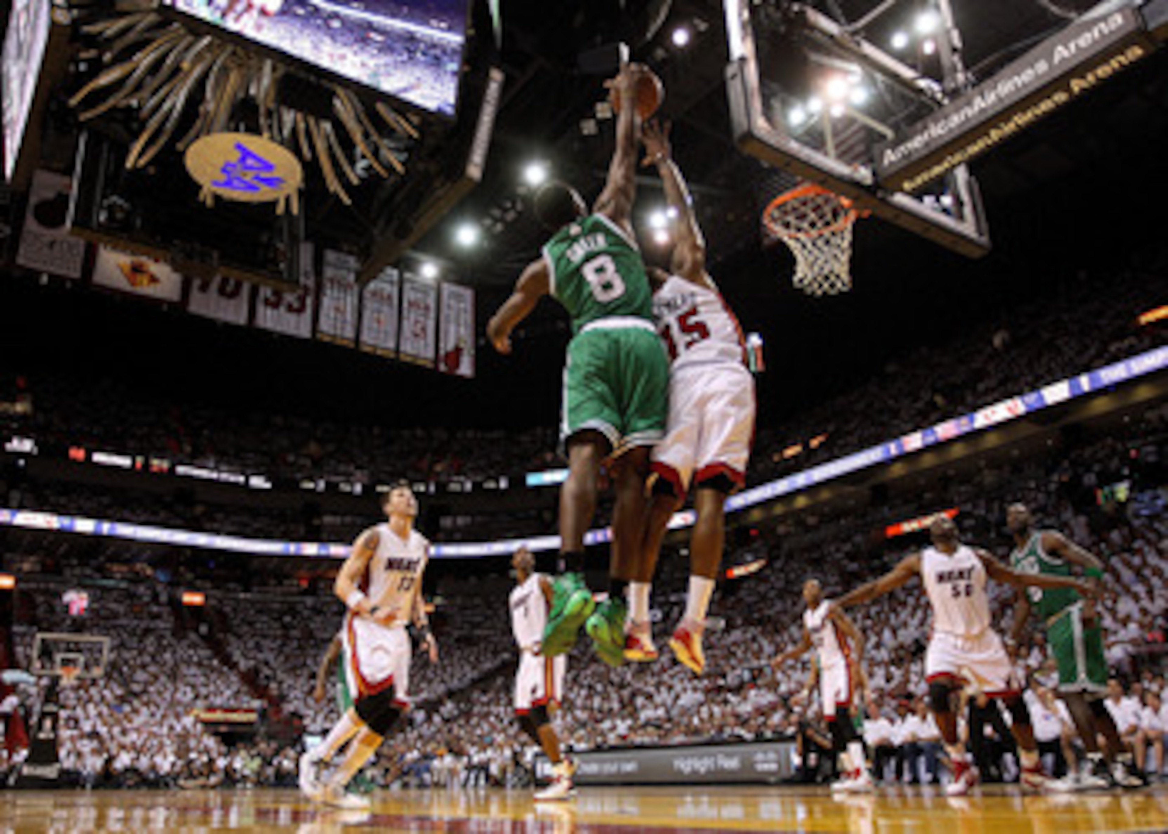 MIAMI, FL - MAY 01:  Mario Chalmers #15 of the Miami Heat has a shot blocked by Jeff Green #8 of the Boston Celtics during Game One of the Eastern Conference Semifinals of the 2011 NBA Playoffs at American Airlines Arena on May 1, 2011 in Miami, Florida.