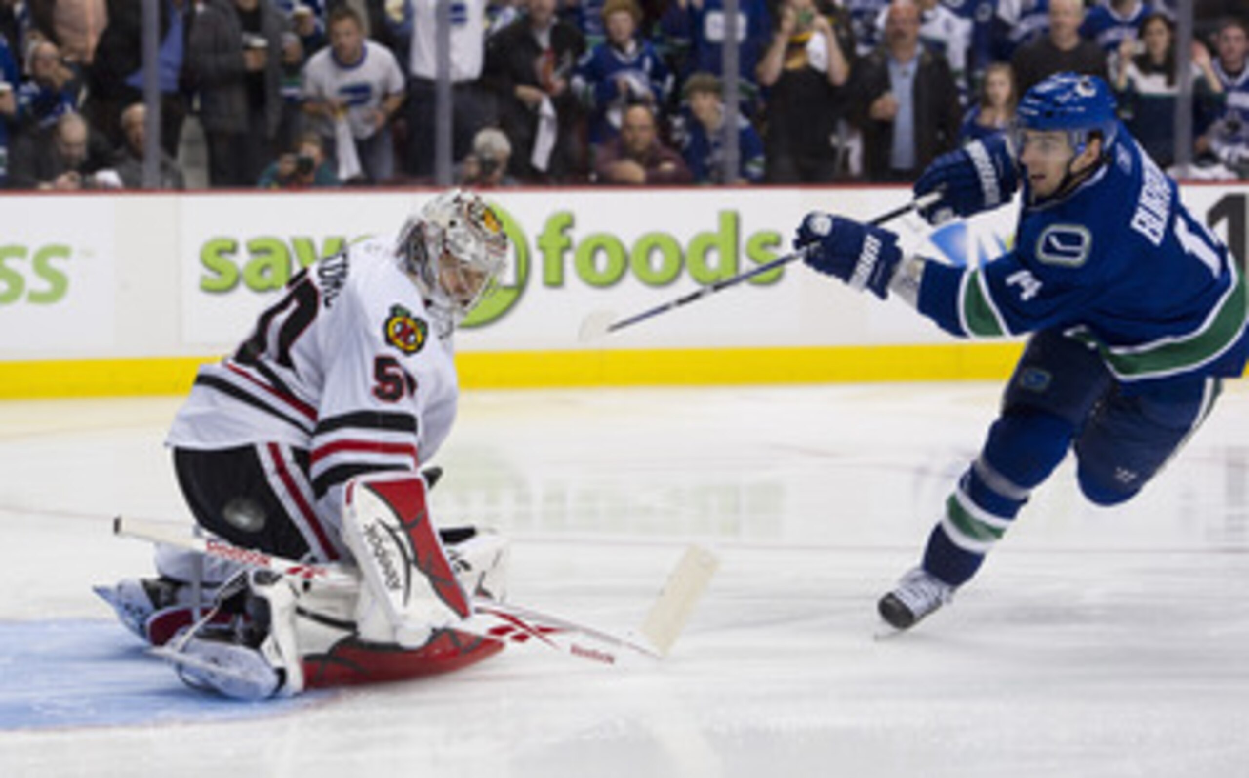 VANCOUVER, CANADA - APRIL 26: Goalie Corey Crawford #50 of the Chicago Blackhawks stops the puck in a penalty shot taken by Alexandre Burrows #14 of the Vancouver Canucks during the third period in Game Seven of the Western Conference Quarterfinals in the