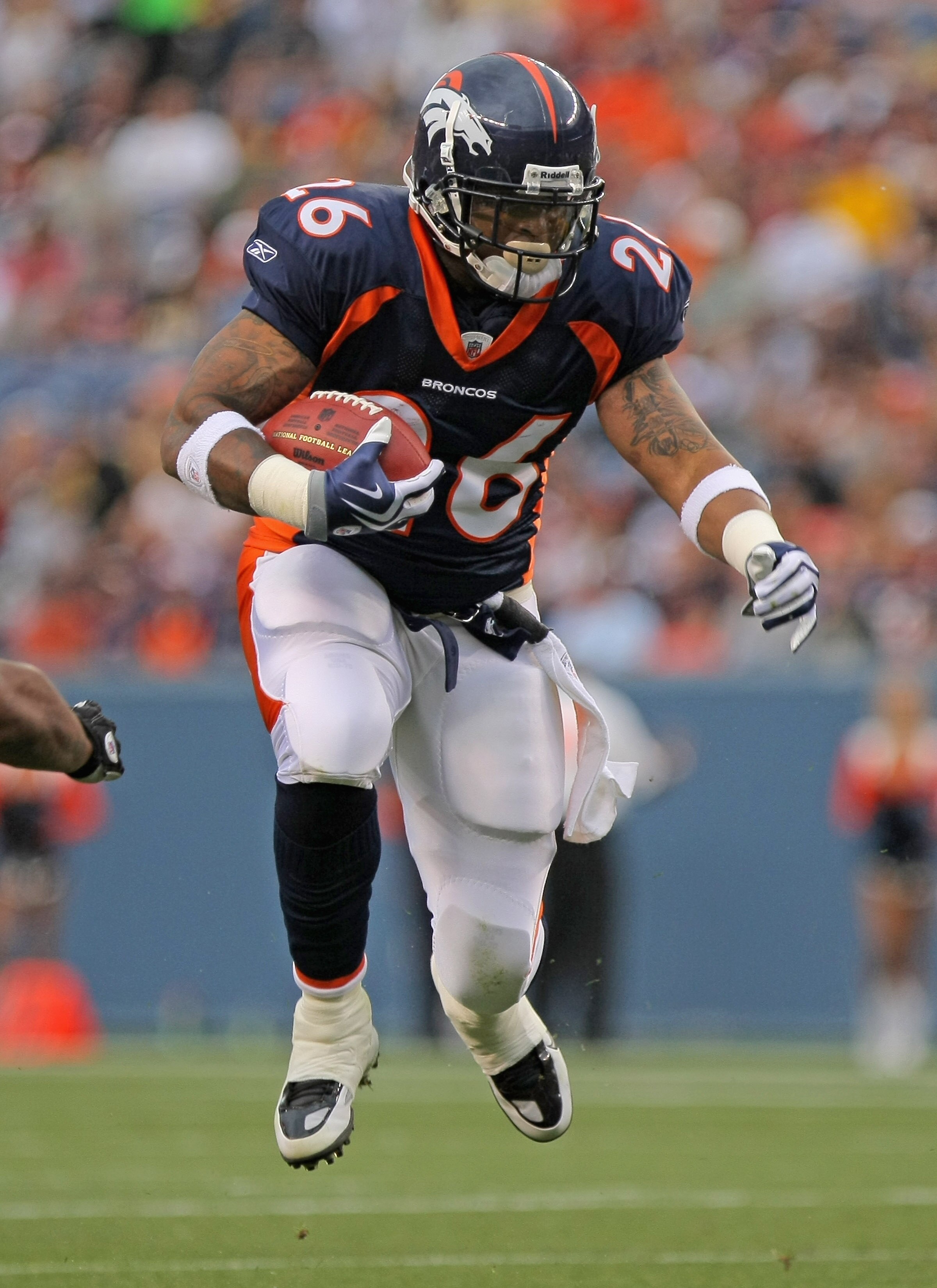 DENVER - AUGUST 29:  Running back LenDale White #26 of the Denver Broncos rushes against the Pittsburgh Steelers during preseason NFL action at INVESCO Field at Mile High on August 29, 2010 in Denver, Colorado.  (Photo by Doug Pensinger/Getty Images)