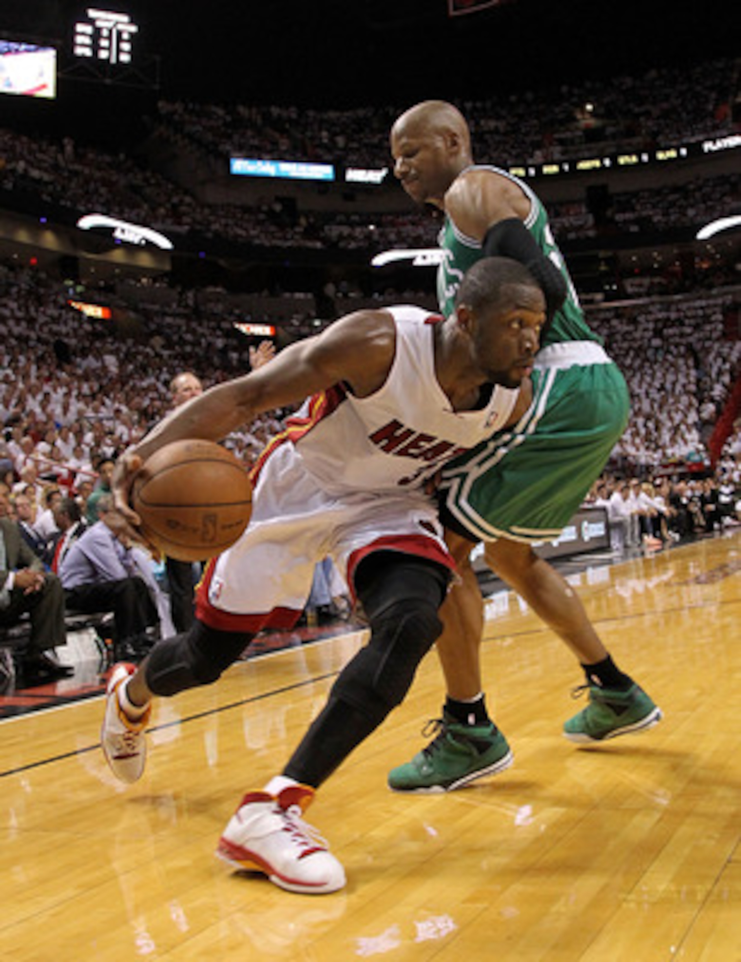 MIAMI, FL - MAY 11:  Dwyane Wade #3 of the Miami Heat drives agaisnt Ray Allen #20 of the Boston Celtics during Game Five of the Eastern Conference Semifinals of the 2011 NBA Playoffs at American Airlines Arena on May 11, 2011 in Miami, Florida. NOTE TO U