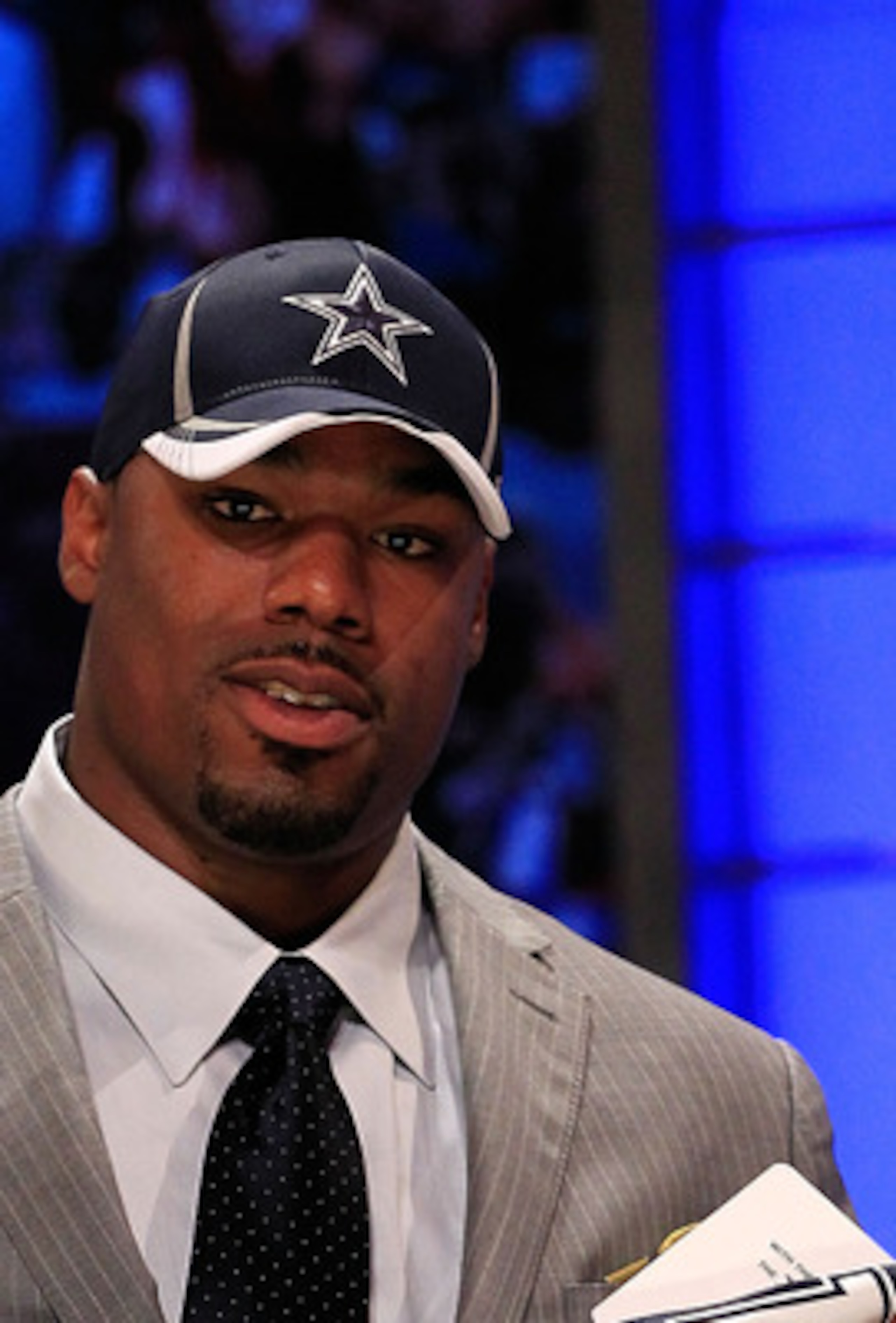 NEW YORK, NY - APRIL 28:  Tyron Smith, #9 overall pick by the Dallas Cowboys, holds up a jersey on stage during the 2011 NFL Draft at Radio City Music Hall on April 28, 2011 in New York City.  (Photo by Chris Trotman/Getty Images)
