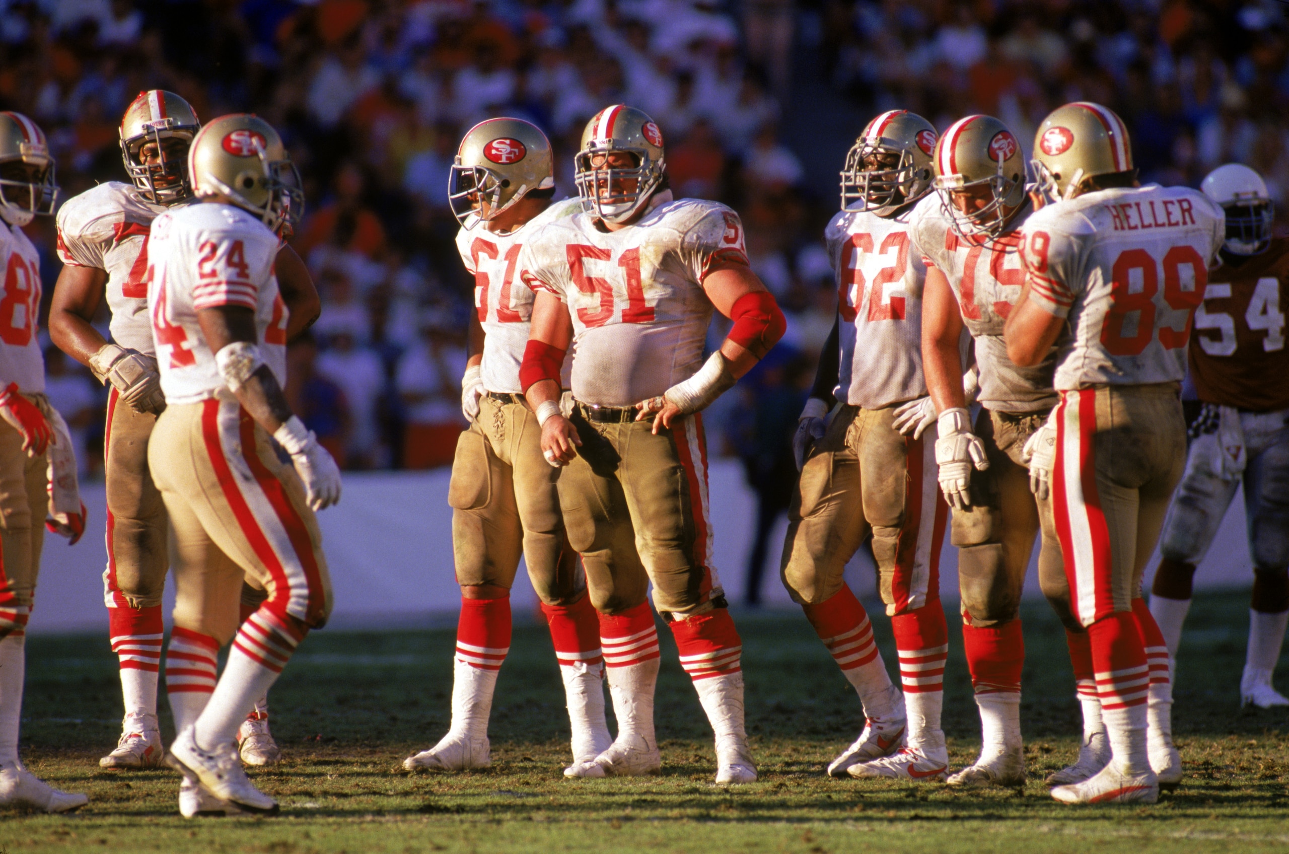TEMPE, AZ - NOVEMBER 6: Center Randy Cross #51 of the San Francisco 49ers waits with his teammates for play to resume during a game against the Phoenix Cardinals at Sun Devil Stadium on November 6, 1988 in Tempe, Arizona. The Cardinals won 24-23. (Photo TEMPE, AZ - NOVEMBER 6: Center Randy Cross #51 of the San Francisco 49ers waits with his teammates for play to resume during a game against the Phoenix Cardinals at Sun Devil Stadium on November 6, 1988 in Tempe, Arizona. The Cardinals won 24-23. (Photo