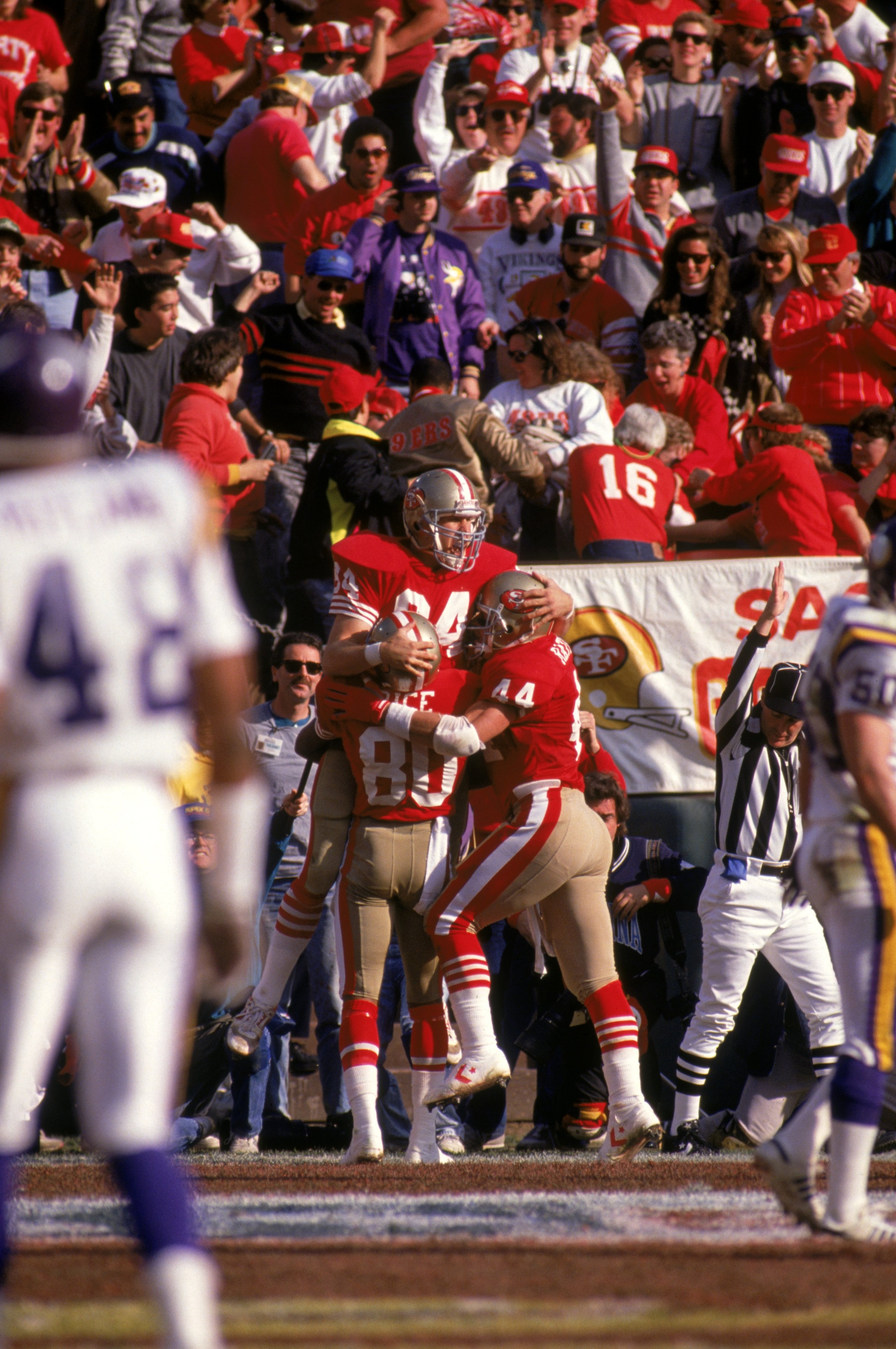 SAN FRANCISCO - JANUARY 6: Tight end Brent Jones #84, wide receiver Jerry Rice #80 and full back Tom Rathman #44 of the San Francisco 49ers celebrate on the field during the 1989 NFC Divisional Playoff game against the Minnesota Vikings at Candlestick Pa SAN FRANCISCO - JANUARY 6: Tight end Brent Jones #84, wide receiver Jerry Rice #80 and full back Tom Rathman #44 of the San Francisco 49ers celebrate on the field during the 1989 NFC Divisional Playoff game against the Minnesota Vikings at Candlestick Pa