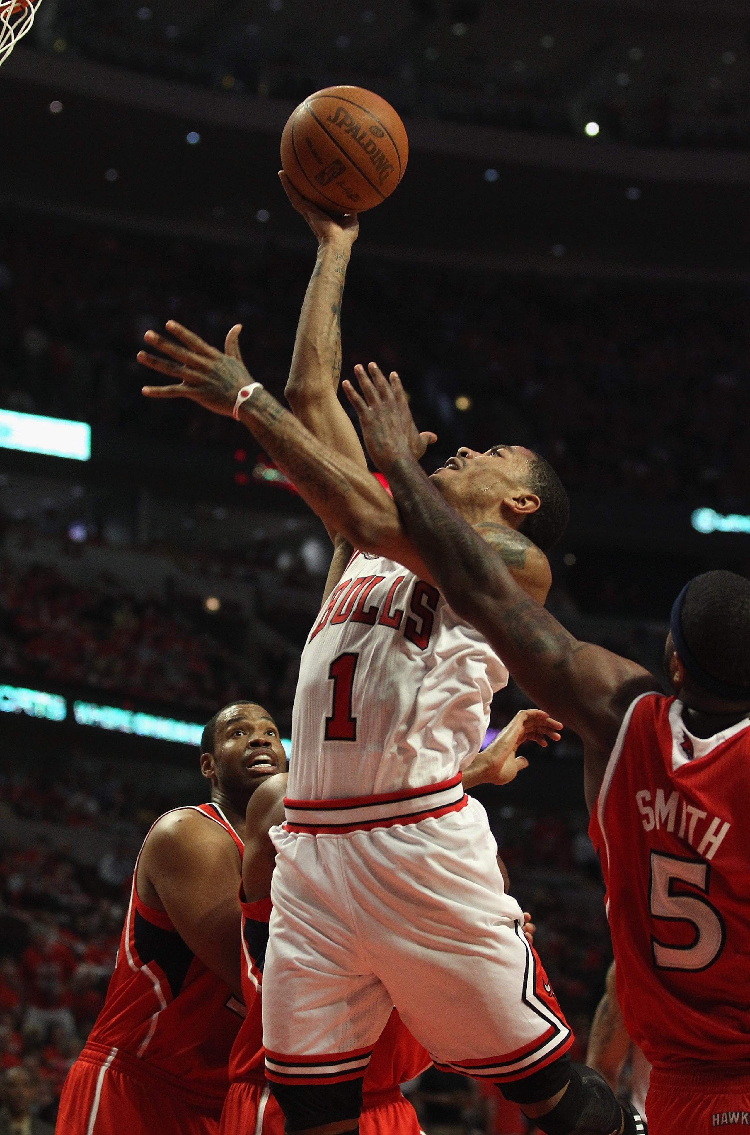 CHICAGO, IL - MAY 10: Derrick Rose #1 of the Chicago Bulls puts up a shot against Josh Smith #5 of the Atlanta Hawks in Game Five of the Eastern Conference Semifinals in the 2011 NBA Playoffs at the United Center on May 10, 2011 in Chicago, Illinois. The