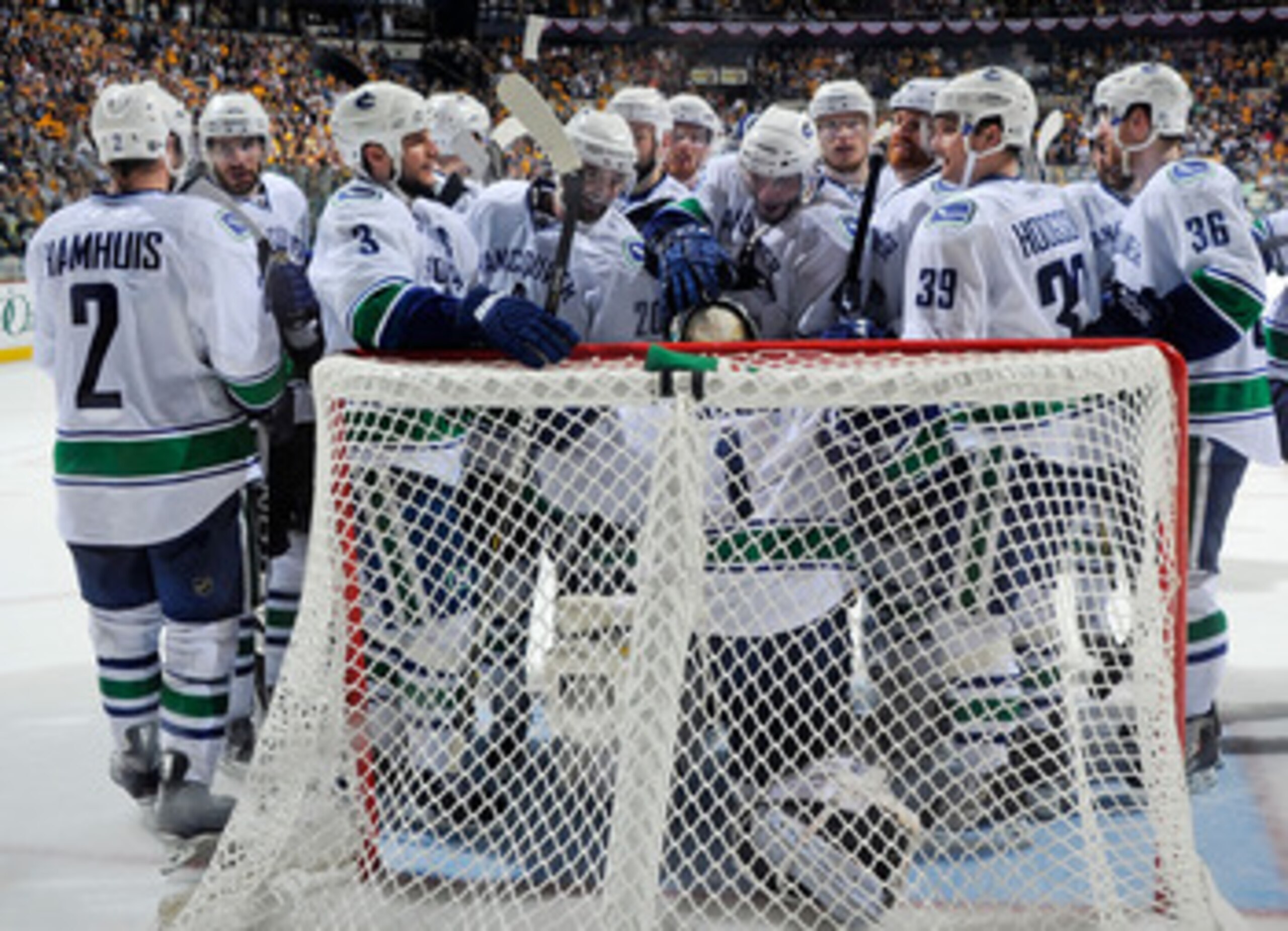 NASHVILLE, TN - MAY 09:  The Vancouver Canucks gather around goalie Roberto Luongo after a win over the Nashville Predators in Game Six of the Western Conference Semifinals during the 2011 NHL Stanley Cup Playoffs at the Bridgestone Arena on May 9, 2011 i