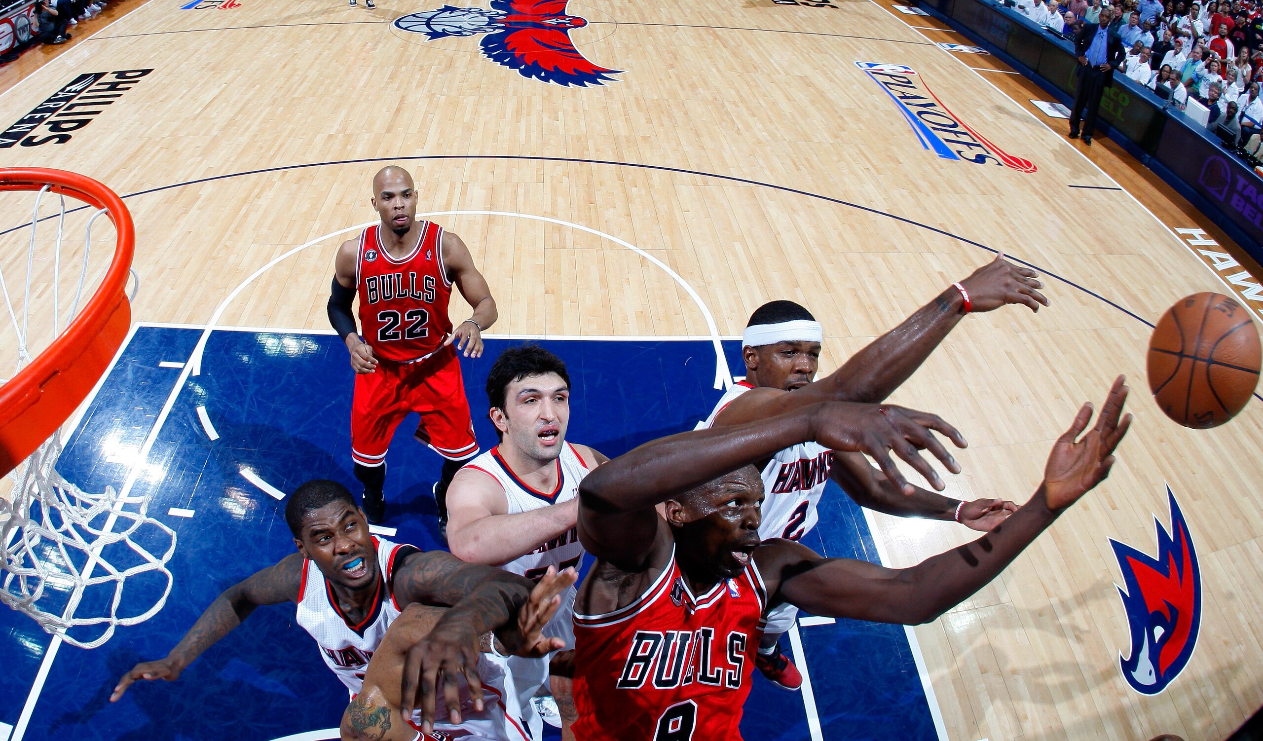 ATLANTA, GA - MAY 08:  Luol Deng #9 of the Chicago Bulls battles for a rebound against Marvin Williams #24, Zaza Pachulia #27 and Joe Johnson #2 of the Atlanta Hawks in Game Four of the Eastern Conference Semifinals in the 2011 NBA Playoffs at Phillips Ar