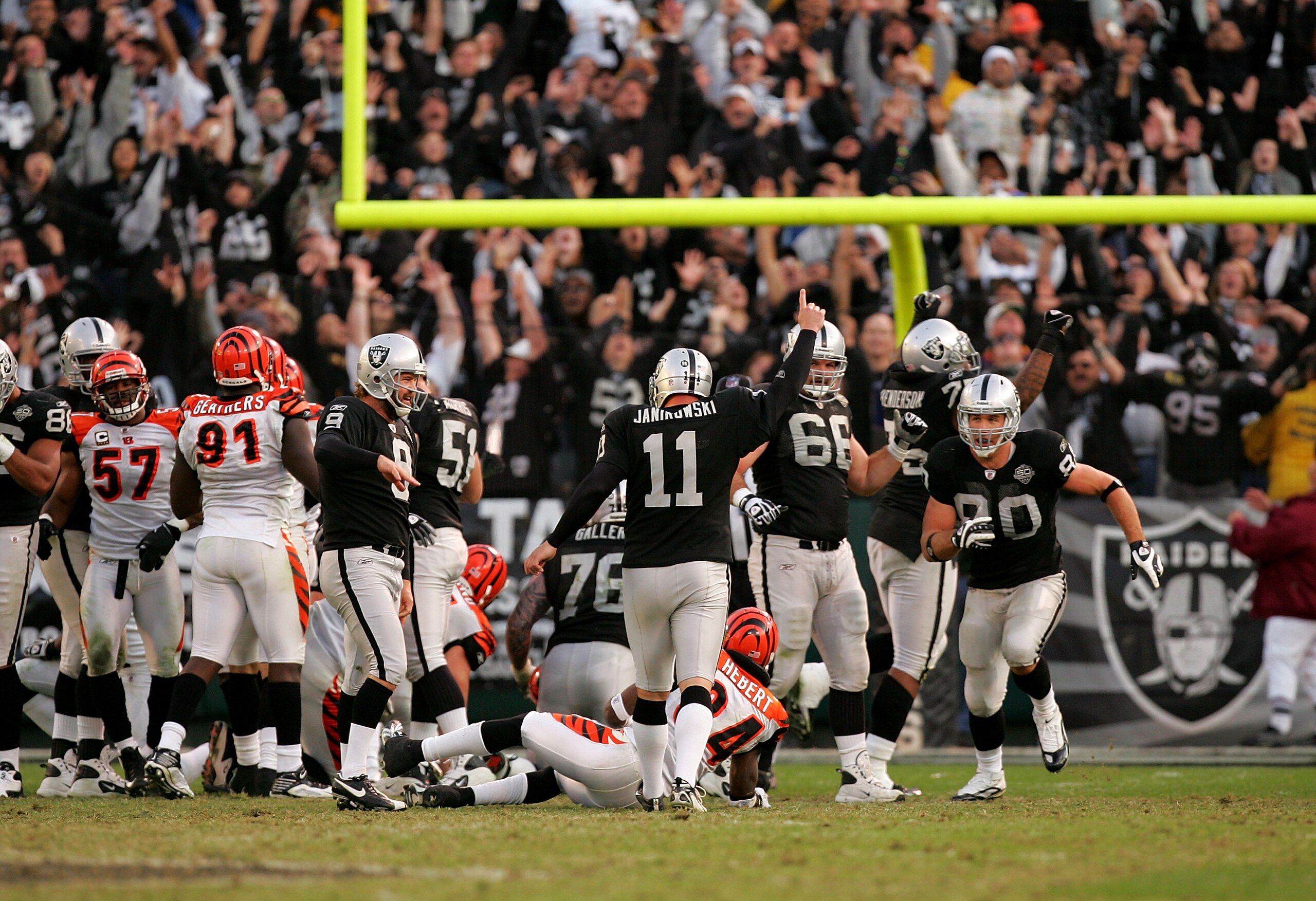 OAKLAND, CA - NOVEMBER 22:  Sebastian Janikowski #11 of the Oakland Raiders celebrates after he kicked the winning field goal with less than a minute to play against the Cincinnati Bengals at Oakland-Alameda County Coliseum on November 22, 2009 in Oakland