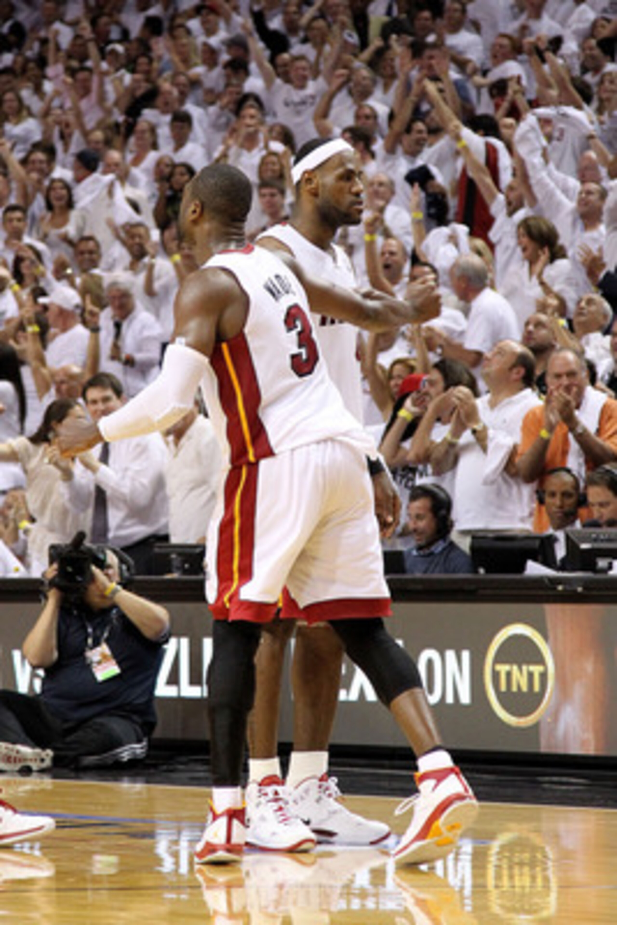 MIAMI, FL - MAY 11:  LeBron James #6 of the Miami Heat is congratulated by Dwyane Wade #3 during Game Five of the Eastern Conference Semifinals of the 2011 NBA Playoffs against the Boston Celtics at American Airlines Arena on May 11, 2011 in Miami, Florid