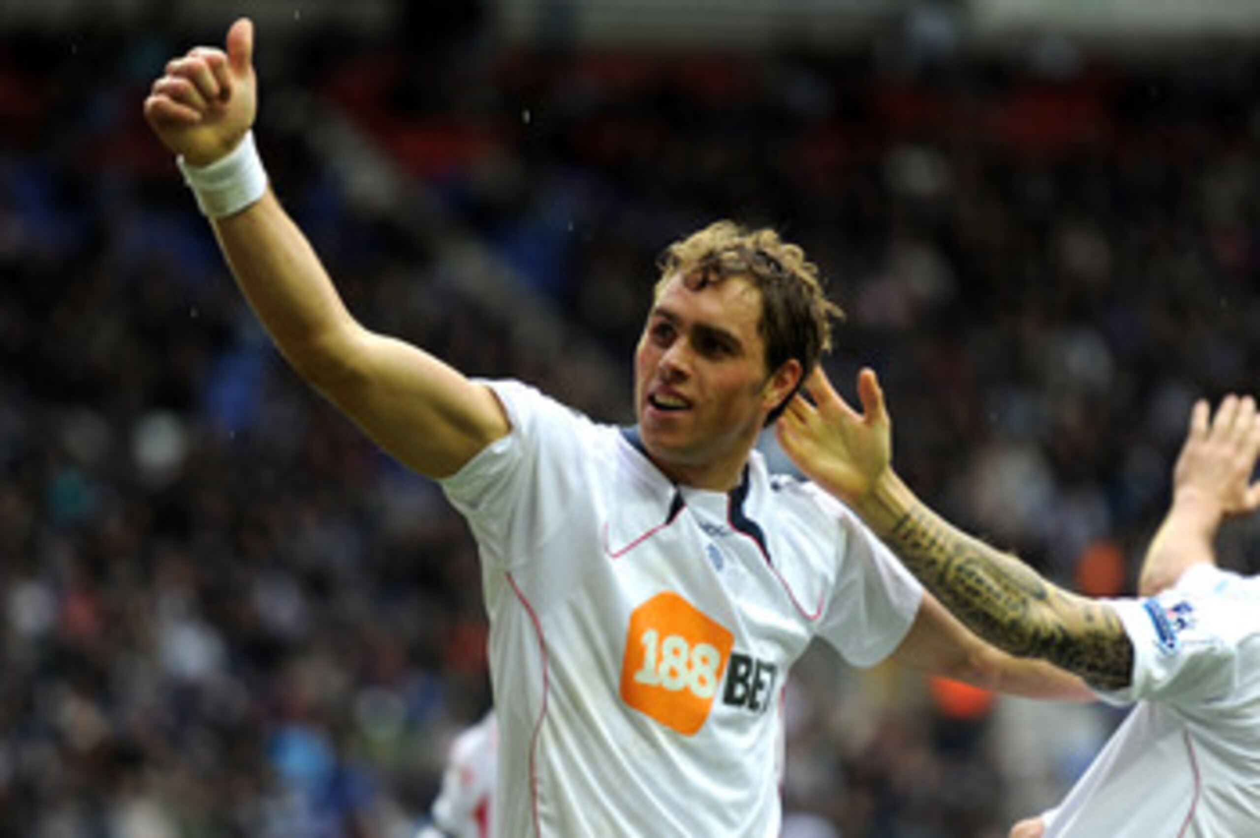 WIGAN, ENGLAND - OCTOBER 23:  Johan Elmander of Bolton Wanderers celebrates scoring his team's first goal during the Barclays Premier League match between Wigan Athletic and Bolton Wanderers at the DW Stadium on October 23, 2010 in Wigan, England.  (Photo
