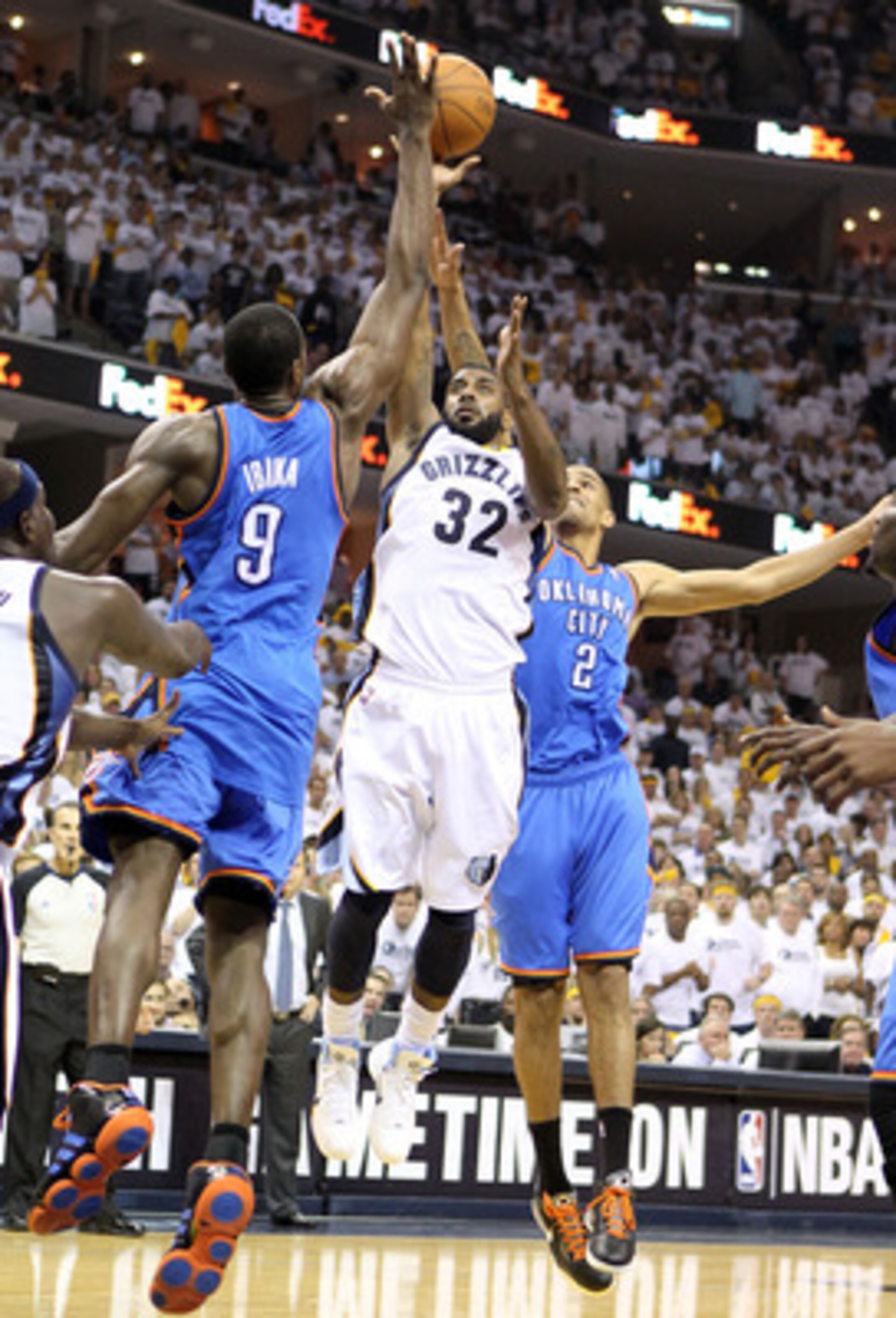 MEMPHIS, TN - MAY 07: O.J. Mayo #32 of the  Memphis Grizzlies shoots the ball while defended by  Serge Ibaka #9 and Thabo Sefolosha #2 of the Oklahoma City Thunder in Game Three of the Western Conference Semifinals in the 2011 NBA Playoffs at FedExForum o