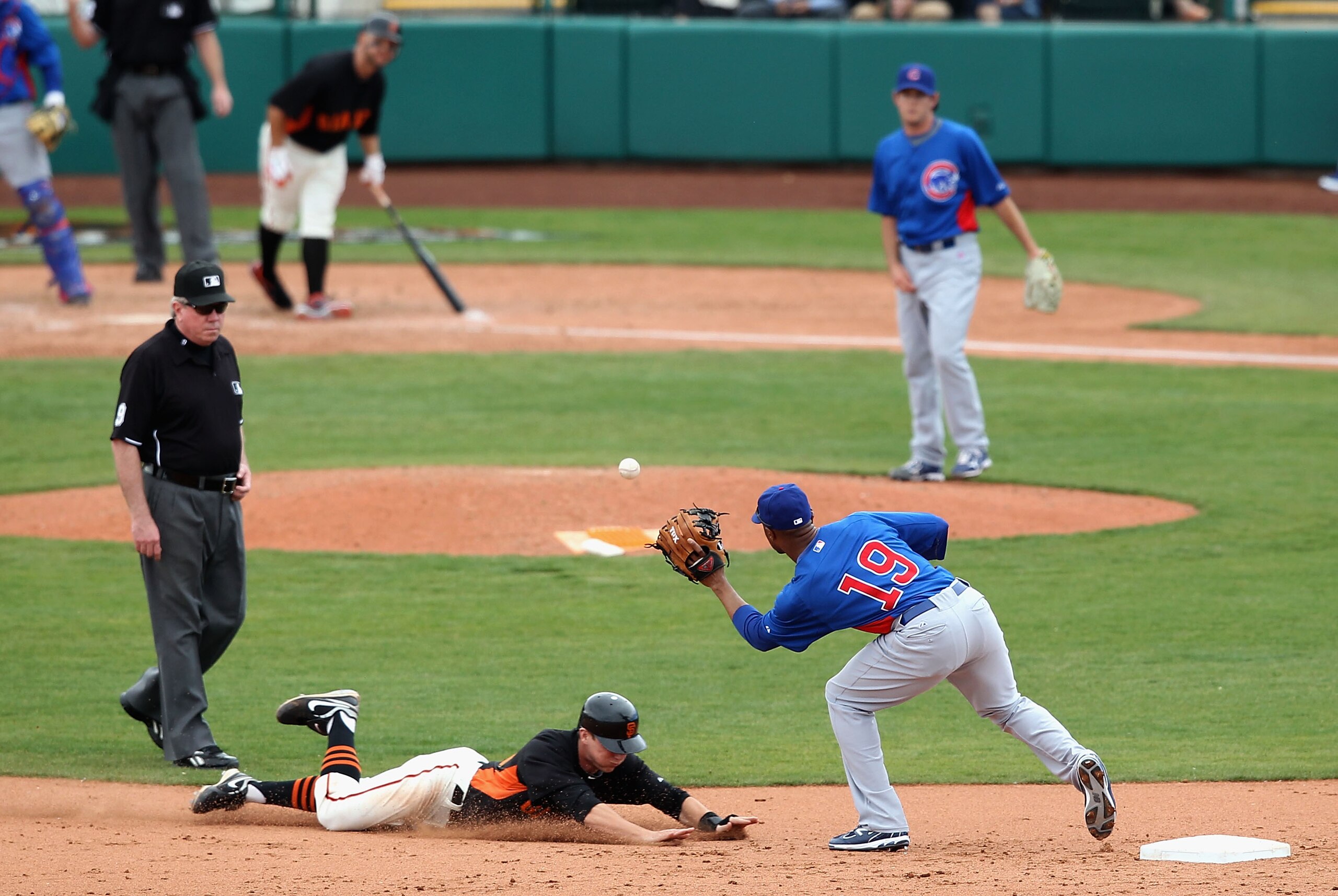 SCOTTSDALE, AZ - MARCH 01: Gary Brown #86 of the San Francisco Giants safely steals second base under the tag from infielder Bobby Scales #19 of the Chicago Cubs during the spring training game at Scottsdale Stadium on March 1, 2011 in Scottsdale, Arizon SCOTTSDALE, AZ - MARCH 01: Gary Brown #86 of the San Francisco Giants safely steals second base under the tag from infielder Bobby Scales #19 of the Chicago Cubs during the spring training game at Scottsdale Stadium on March 1, 2011 in Scottsdale, Arizon