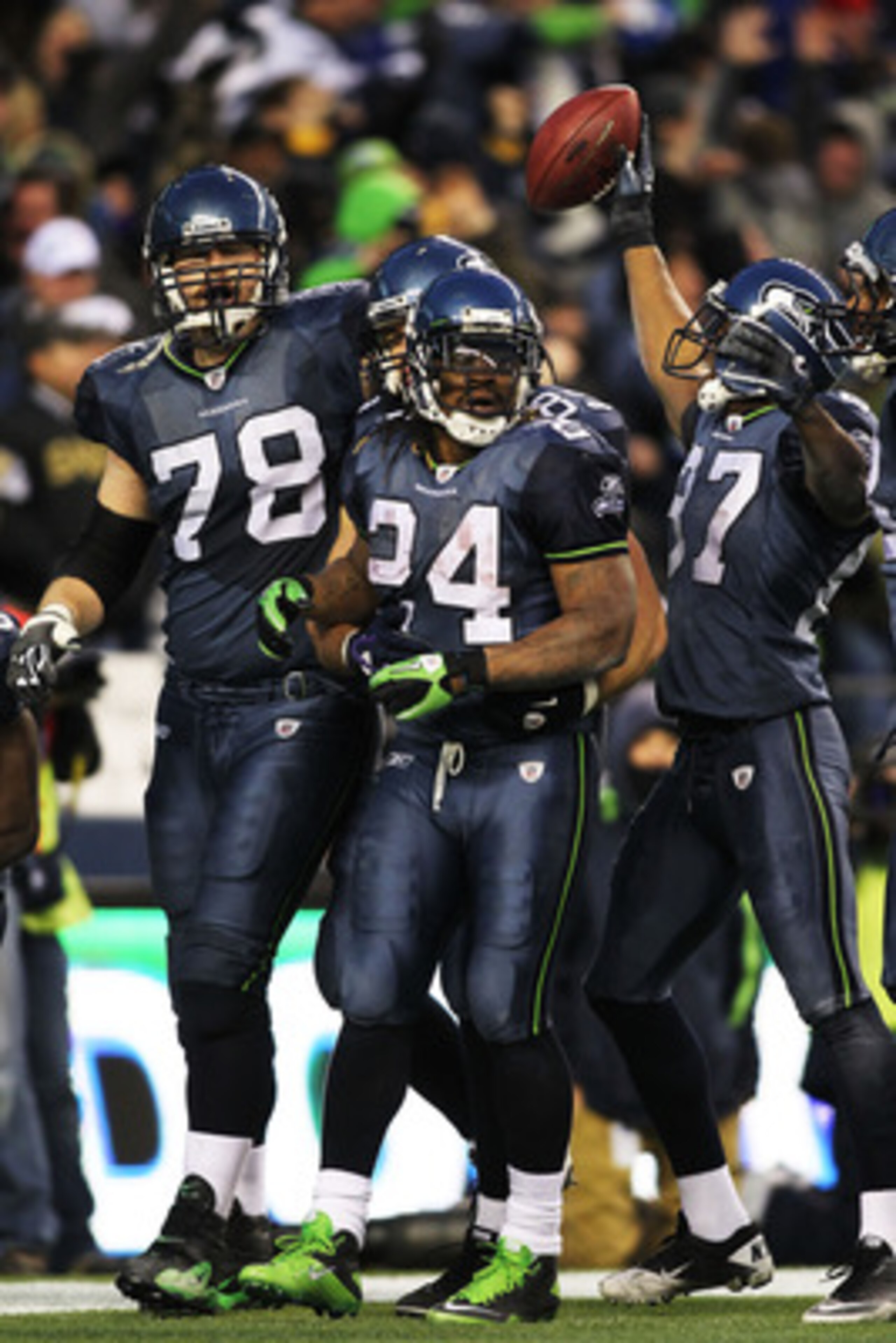 SEATTLE, WA - JANUARY 08:  Running back Marshawn Lynch #24 of the Seattle Seahawks celebrates his 67-yard touchdown run in the fourth quarter against the New Orleans Saints during the 2011 NFC wild-card playoff game at Qwest Field on January 8, 2011 in Se