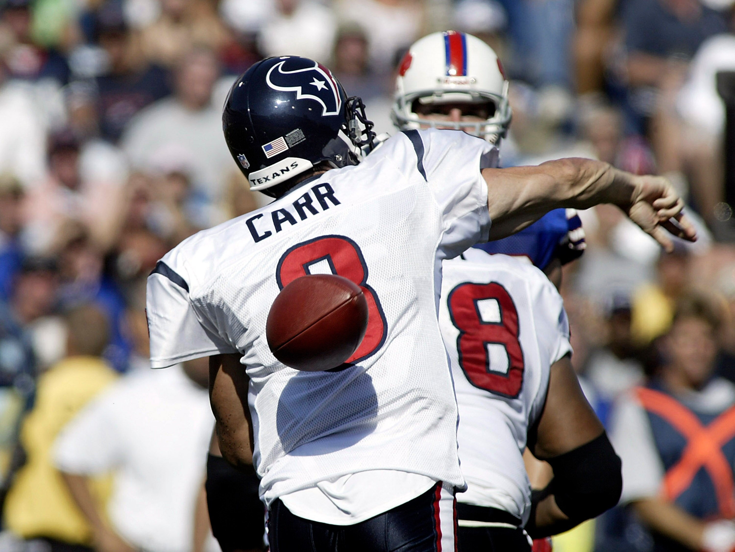 ORCHARD PARK, NY - SEPTEMBER 11: David Carr #8 of the Houston Texans fumbles the ball while trying to pass against the Buffalo Bills on September 11, 2005 at Ralph Wilson Stadium in Orchard Park, New York. (Photo by Rick Stewart/Getty Images)