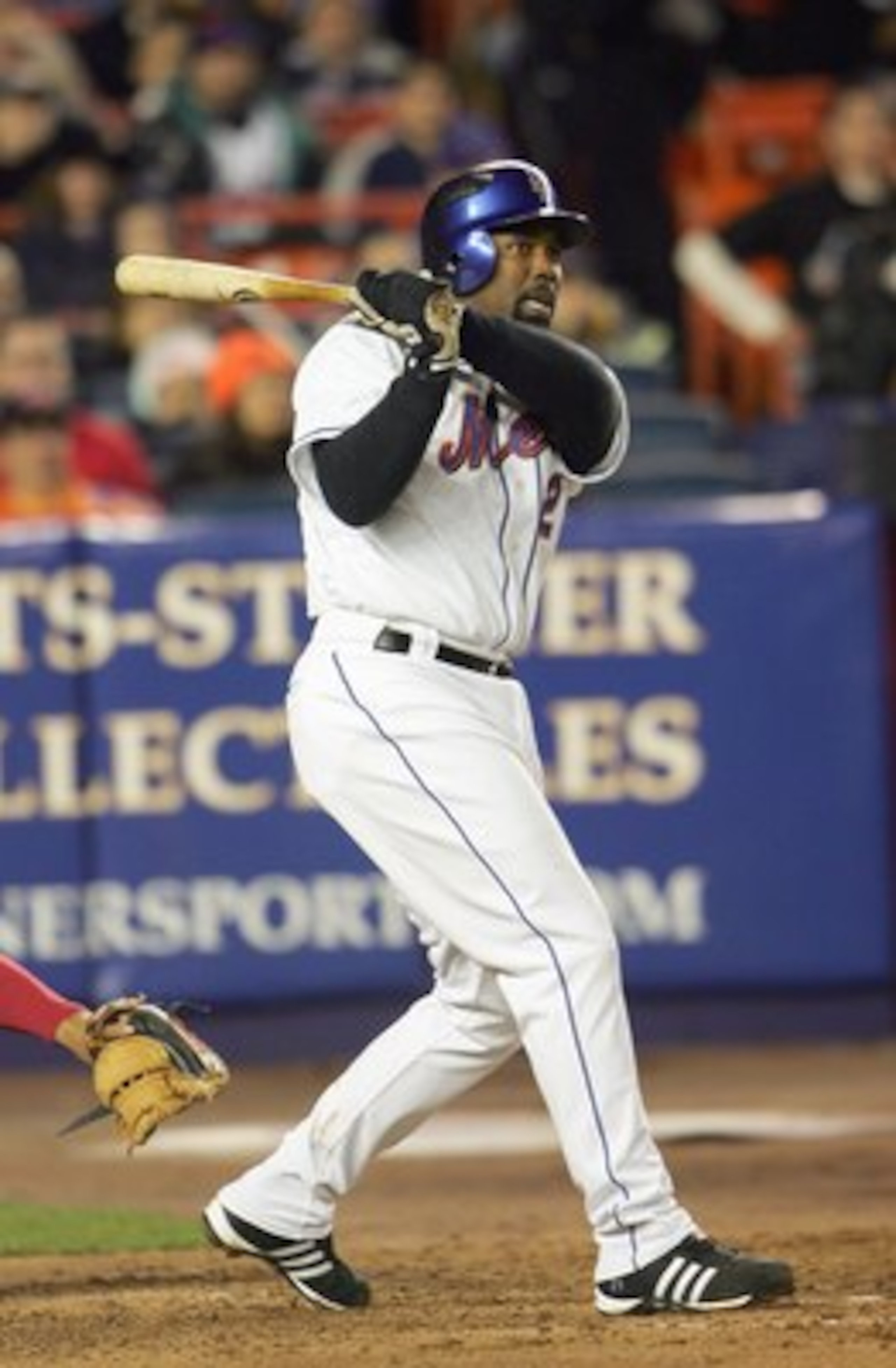 NEW YORK - APRIL 11: Carlos Delgado #21 of the New York Mets swings at the pitch during the MLB game against the Philadelphia Phillies at Shea Stadium on April 11, 2007 in the Flushing neighborhood of the Queens borough of New York City. (Photo by Chris M