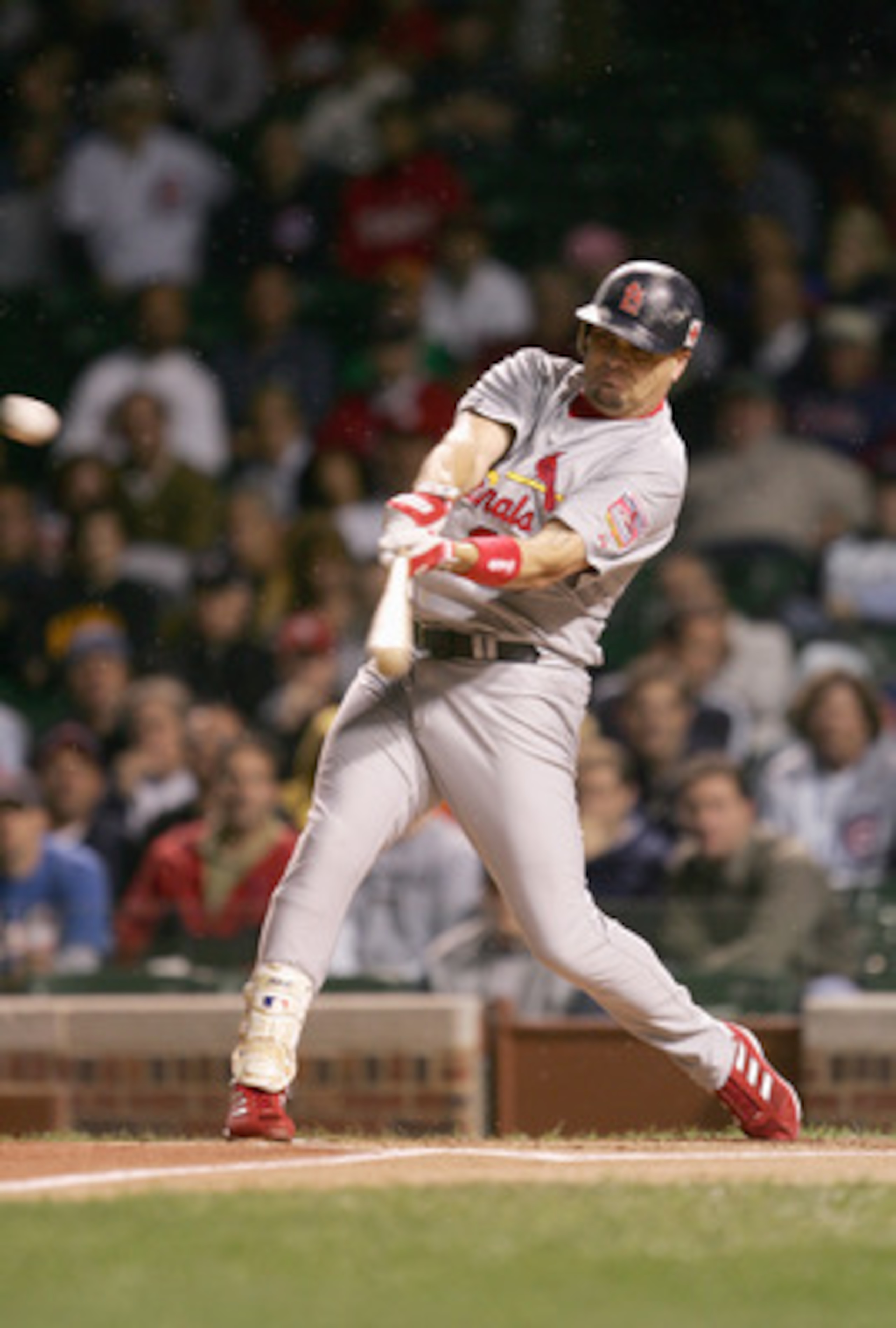 CHICAGO - SEPTEMBER 15: Larry Walker #33 of the St. Louis Cardinals swings at the pitch during the game against the Chicago Cubs  on September 15, 2005 at Wrigley Field in Chicago, Illinois. The Cardinals won 6-1. (Photo by Jonathan Daniel/Getty Images)