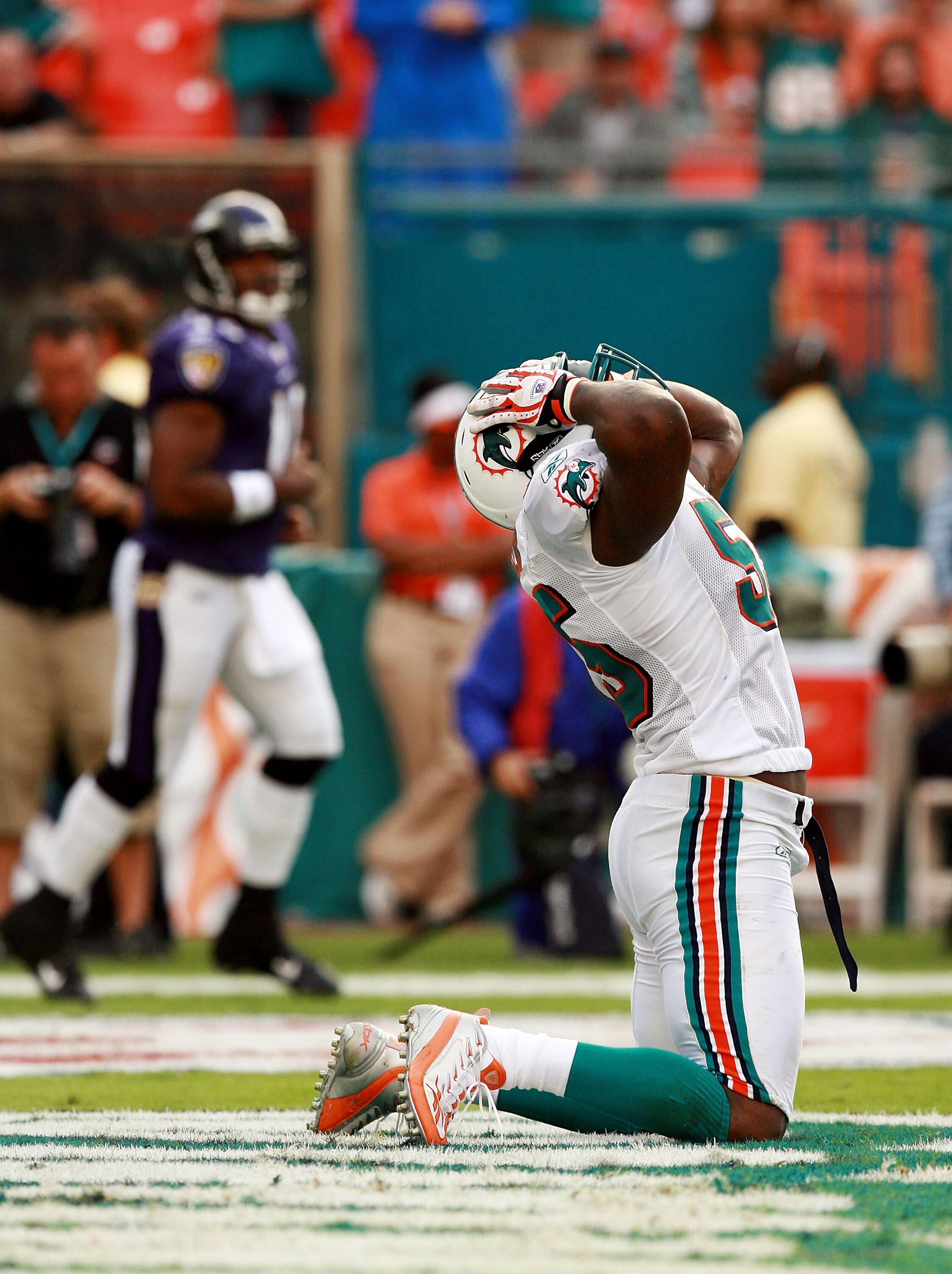 MIAMI - DECEMBER 16:  Linebacker Joey Porter #55 of the Miami Dolphins reacts after narrowly missing a sack in the endzone on quarterback Troy Smith #10 of the Baltimore Ravens at Dolphin Stadium on December 16, 2007 in Miami, Florida. The Dolphins defeat