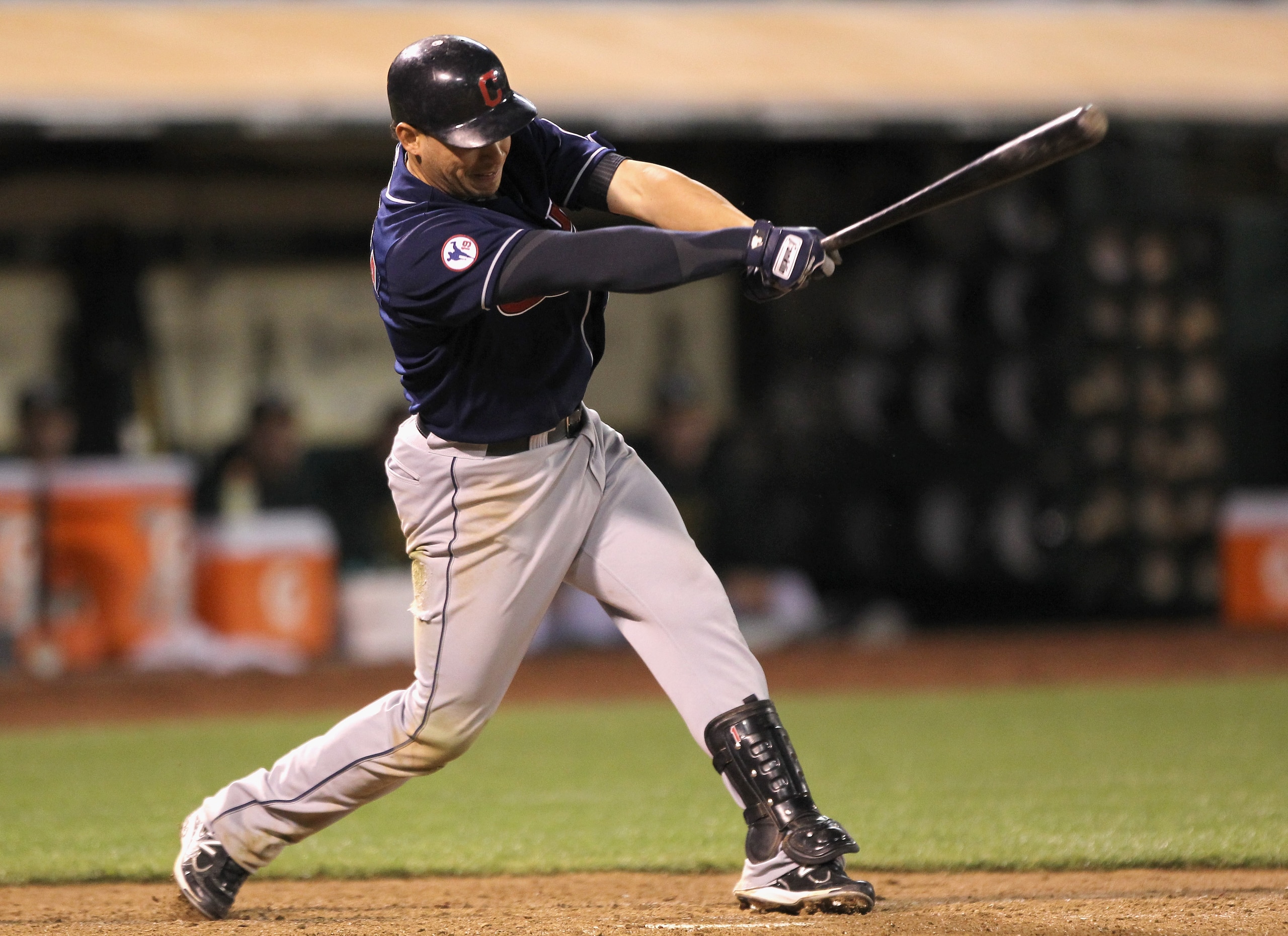 OAKLAND, CA - MAY 03:  Asdrubal Cabrera #13 of the Cleveland Indians hits a two run single in the ninth inning to give the Indians a 4-1 lead over the Oakland Athletics at Oakland-Alameda County Coliseum on May 3, 2011 in Oakland, California.  (Photo by E