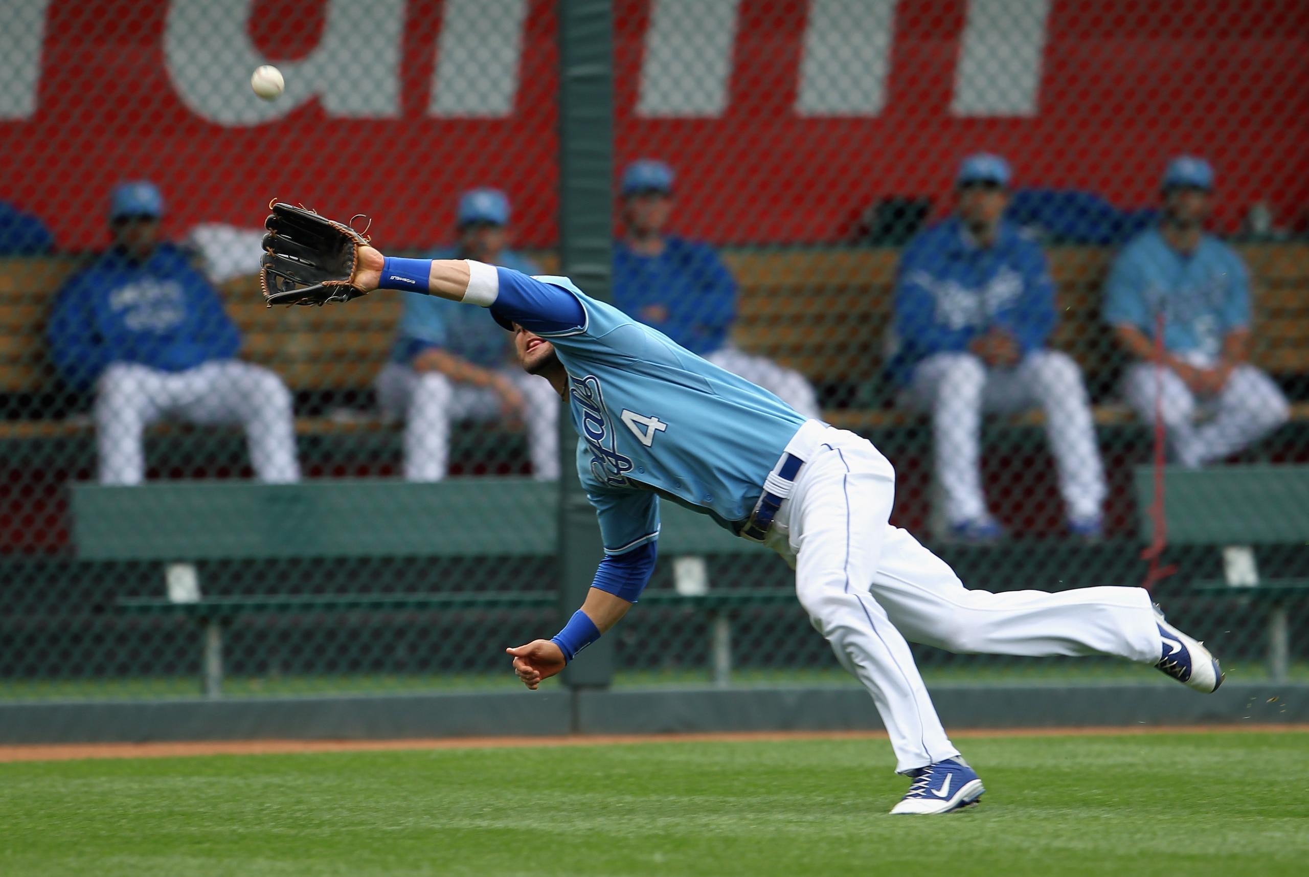 KANSAS CITY, MO - APRIL 17:  Alex Gordon #4 of the Kansas City Royals dives for a fly ball during the game against the Seattle Mariners on April 17, 2011 at Kauffman Stadium in Kansas City, Missouri.  (Photo by Jamie Squire/Getty Images)