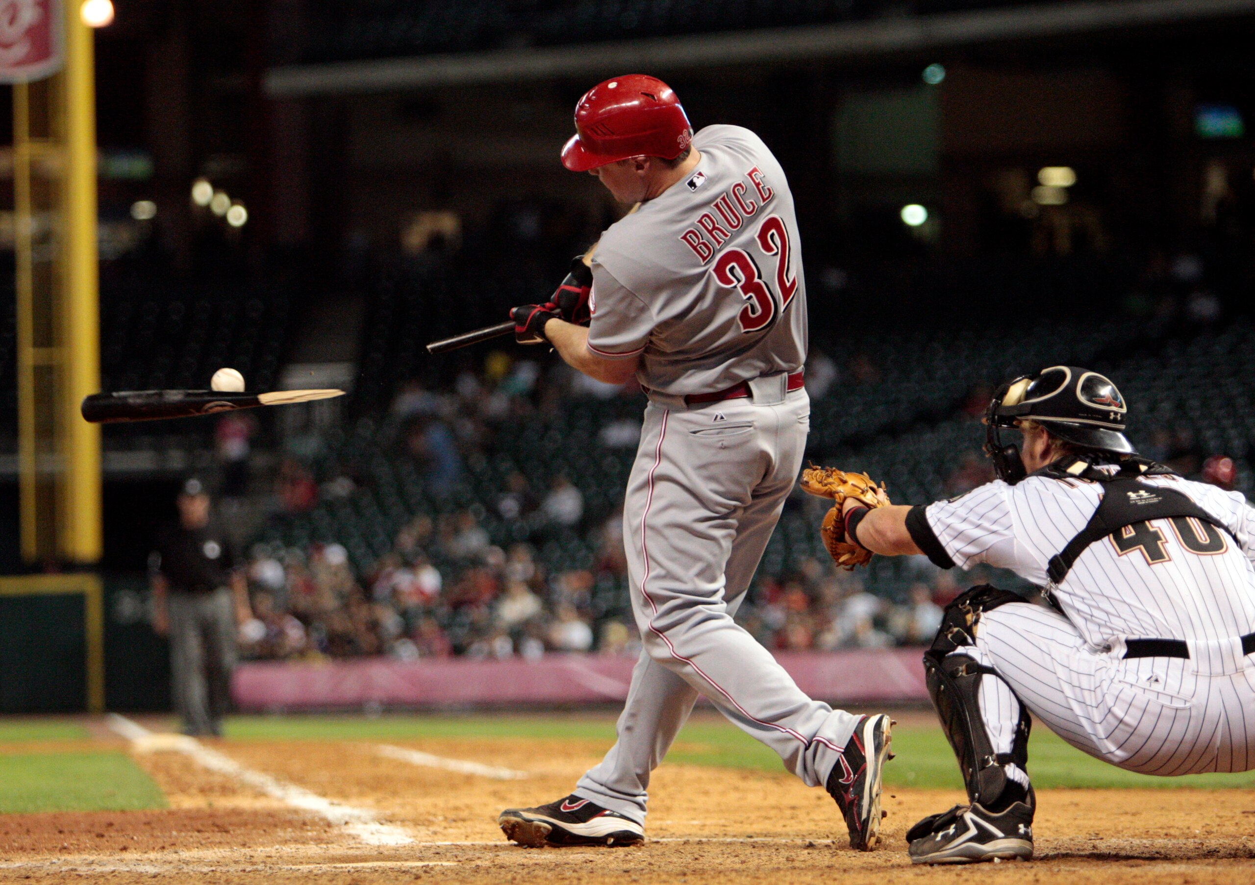 HOUSTON - MAY 09:  Jay Bruce #32 of the Cincinnati Reds breaks his bat  as he hits an infield single to first base in the ninth inning as catcher J.R. Towles #46 looks on at Minute Maid Park on May 9, 2011 in Houston, Texas.  (Photo by Bob Levey/Getty Ima