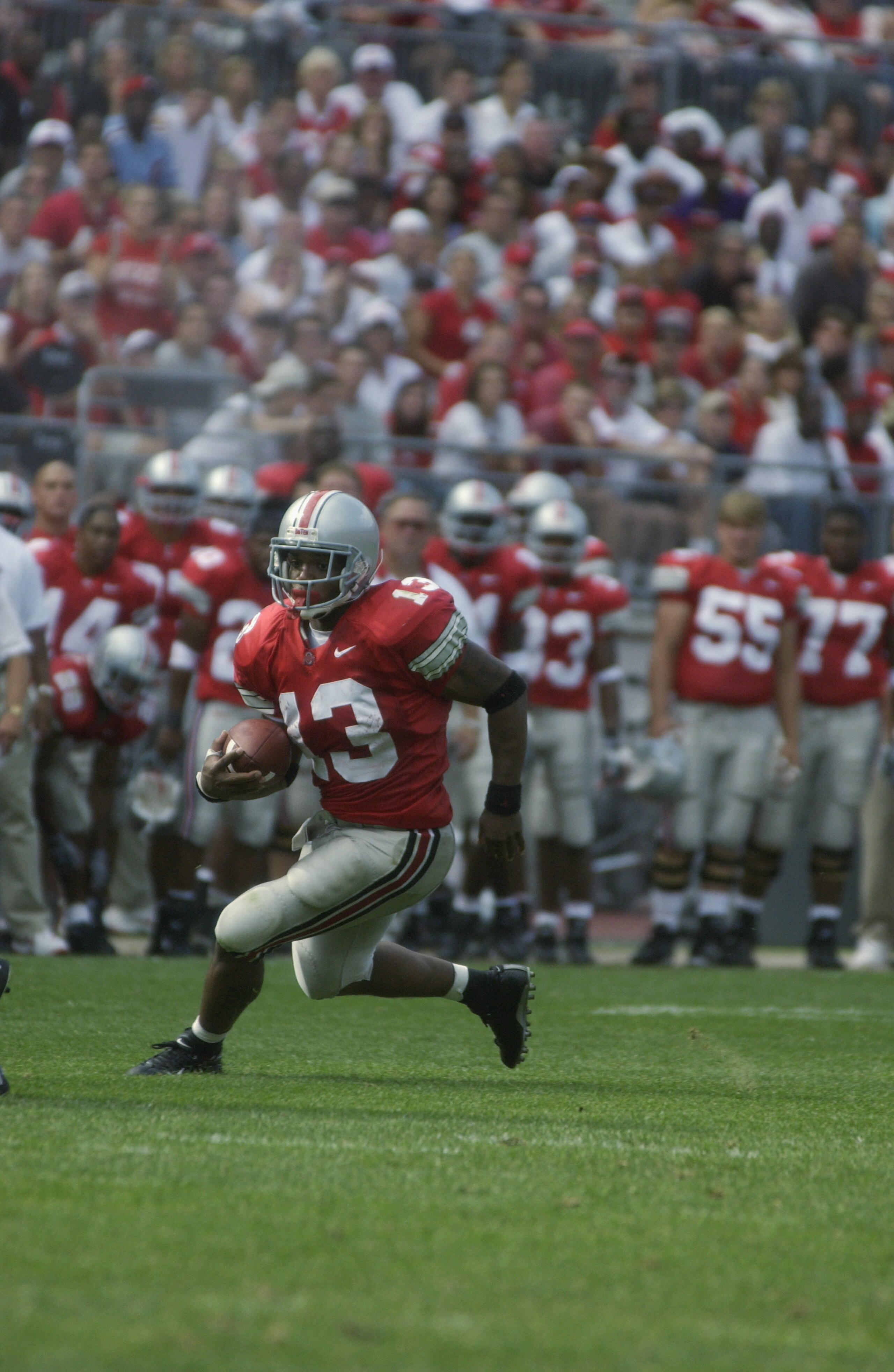 COLUMBUS, OH - AUGUST 24:  Running back Maurice Clarett #13 of the Ohio State Buckeyes runs with the ball during the NCAA Pigskin Classic against the Texas Tech Red Raiders on August 24, 2002 at Ohio Stadium in Columbus, Ohio. Ohio State defeated Texas Te