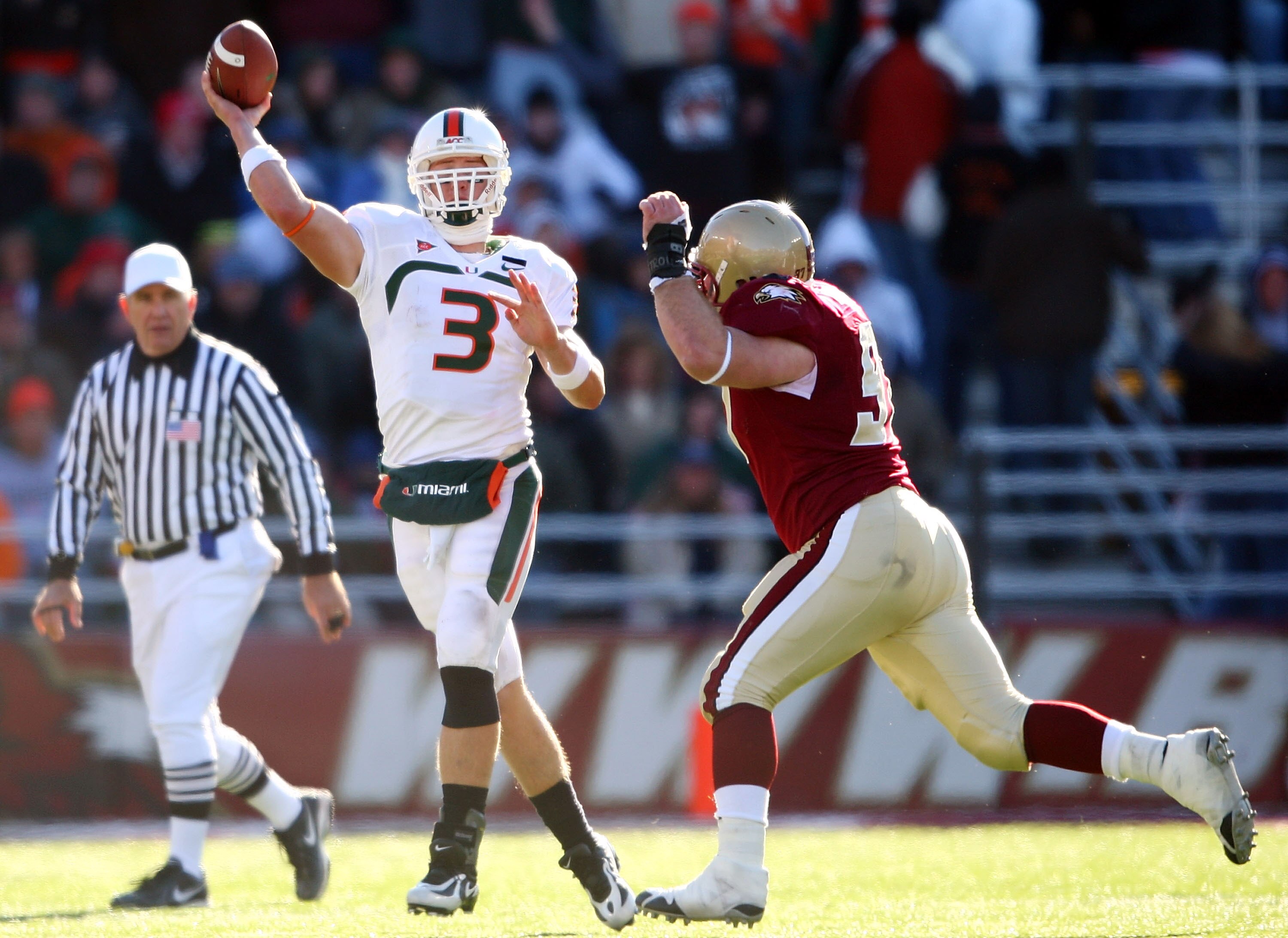 CHESTNUT HILL, MA - NOVEMBER 24:  Kyle Wright #3 of the Miami Hurricanes passes under pressure from Brady Smith #97 of the Boston College Eagles  on November 24, 2007 at Alumni Stadium in in Chestnut Hill, Massachusetts.  (Photo by Elsa/Getty Images)