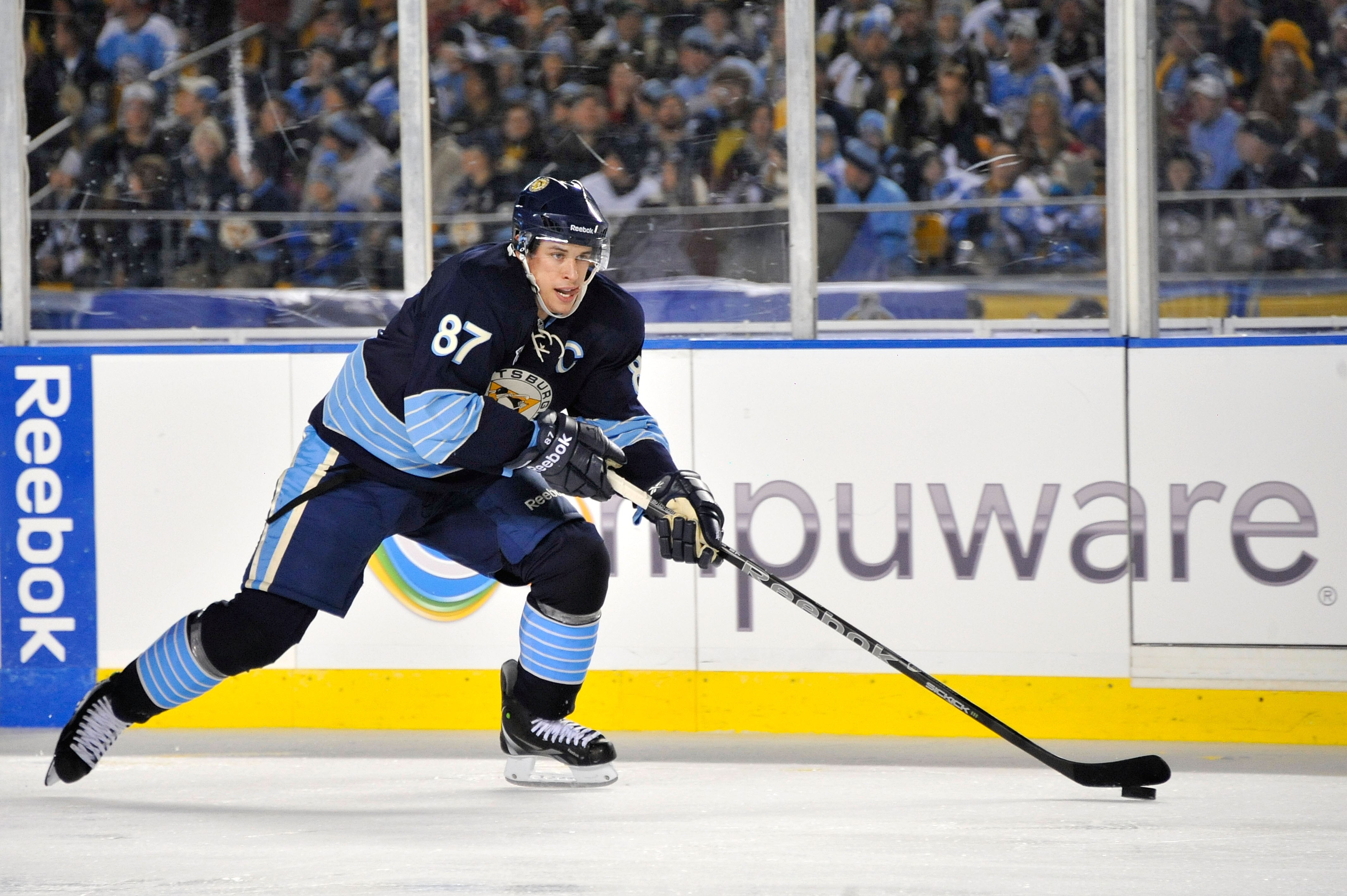 PITTSBURGH, PA - JANUARY 01:  Sidney Crosby #87 of the Pittsburgh Penguins looks to pass against the Washington Capitals during the 2011 NHL Bridgestone Winter Classic at Heinz Field on January 1, 2011 in Pittsburgh, Pennsylvania. Washington won 3-1. (Pho