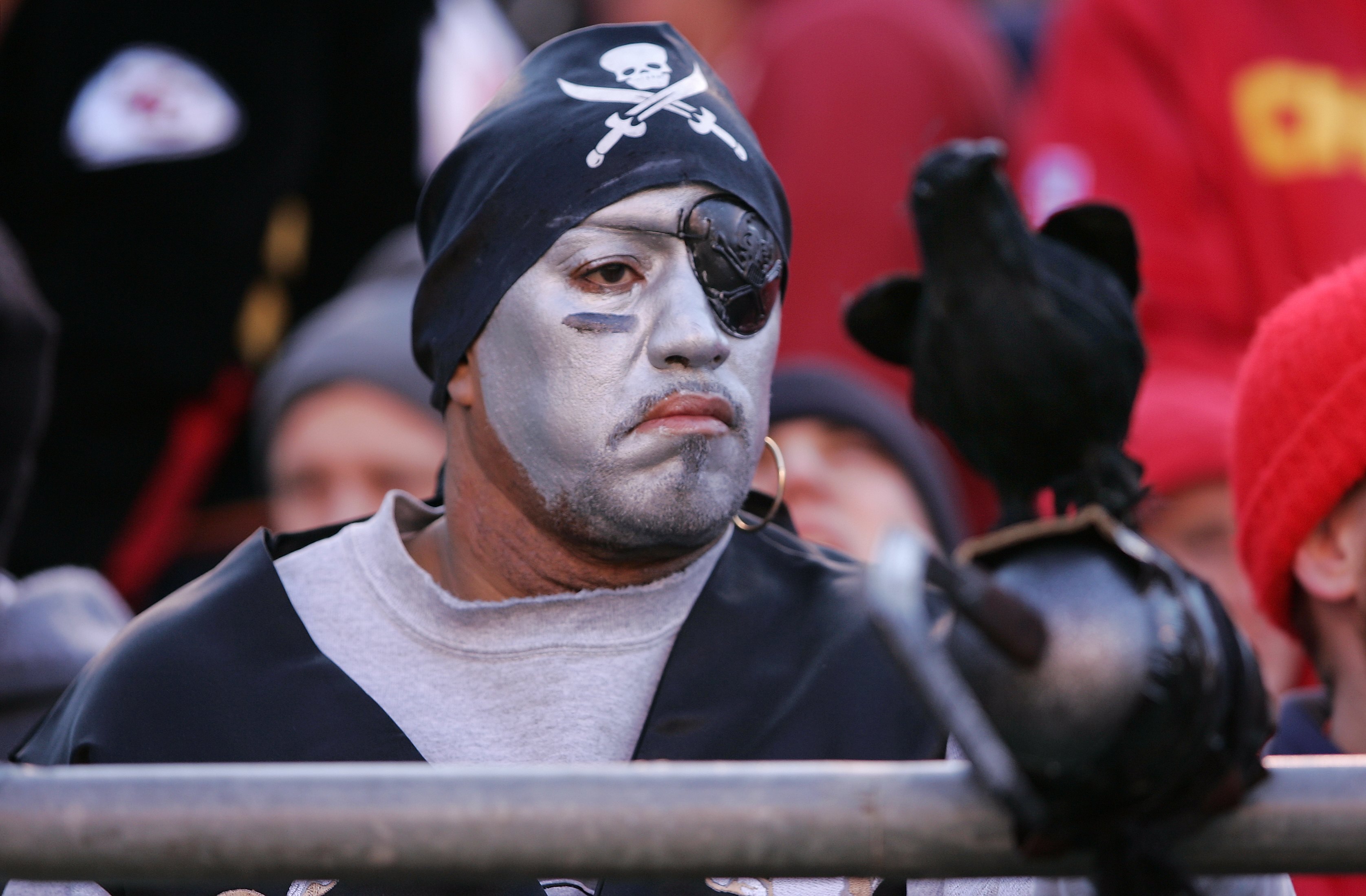 KANSAS CITY, MO - NOVEMBER 19:  An Oakland Raiders fan watches the game against the Kansas City Chiefs on November 19, 2006 at Arrowhead Stadium in Kansas City, Missouri.  The Chiefs won 17-13.  (Photo by Brian Bahr/Getty Images)