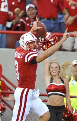 LINCOLN, NE - SEPTEMBER 04:  Taylor Matinez  #3 of the Nebraska Cornhuskers scores his first touchdown as a Cornhusker during the first half of  their game against the Western Kentucky Hilltoppers at Memorial Stadium on September 4, 2010 in Lincoln, Nebra