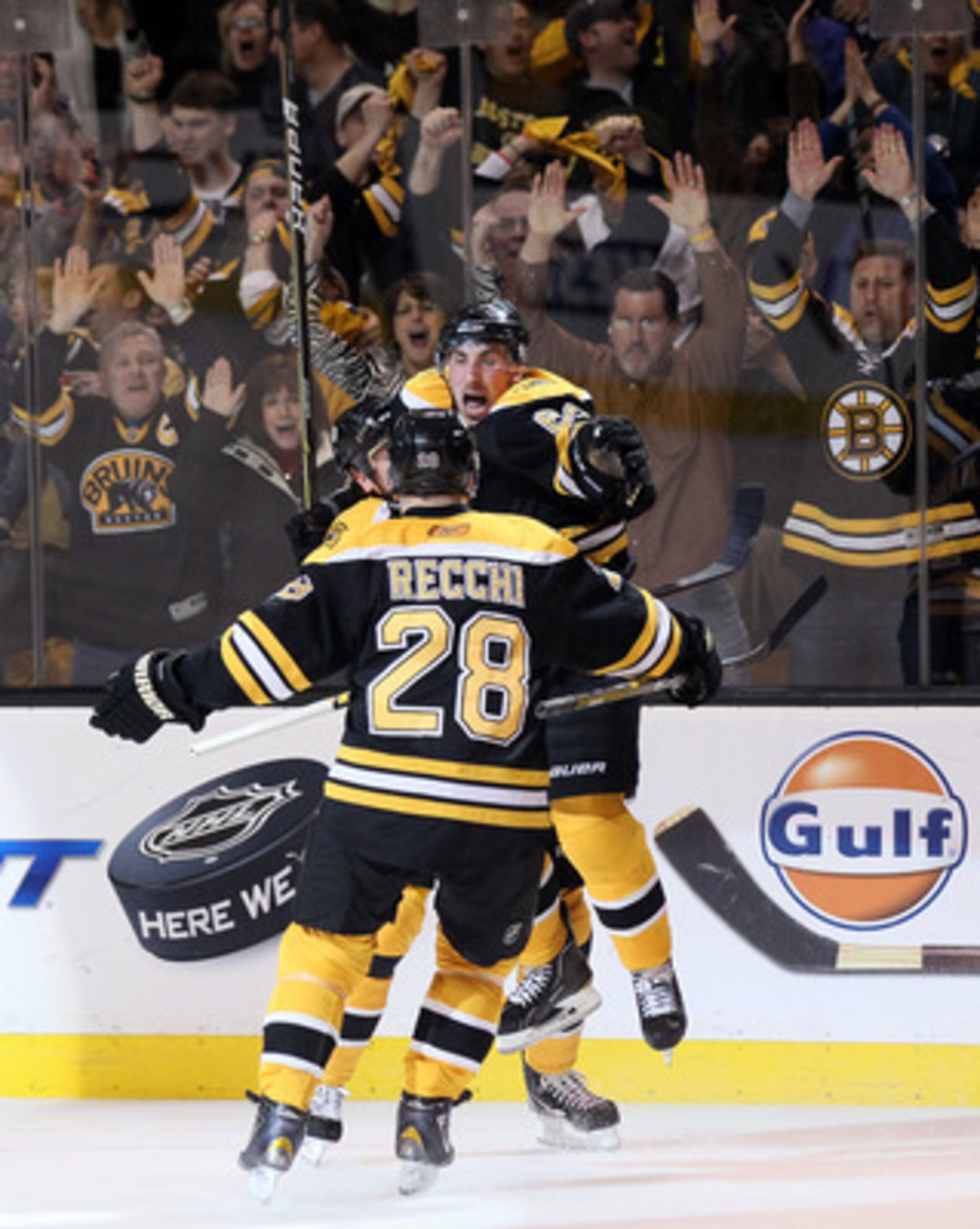BOSTON, MA - APRIL 23:  Brad Marchand #63 of the Boston Bruins celebrates his goal with teammates Mark Recchi #28 and Patrice Bergeron #37  in Game Five of the Eastern Conference Quarterfinals during the 2011 NHL Stanley Cup Playoffs at TD Garden on April