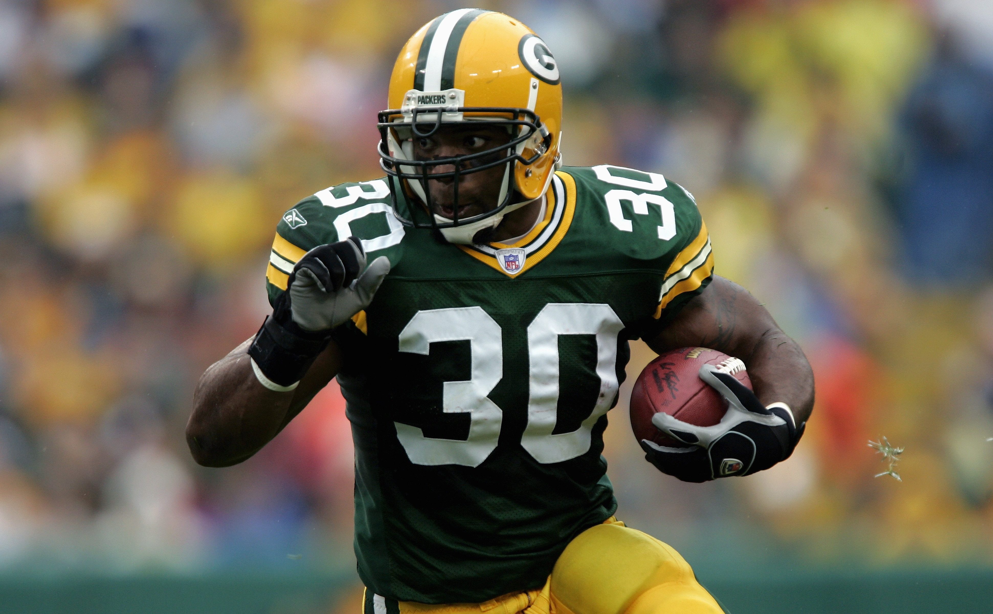 GREEN BAY, WI - SEPTEMBER 25:  Ahman Green #30 of the Green Bay Packers carries the ball during the game with the Tampa Bay Buccaneers on September 25, 2005 at Lambeau Field in Green Bay, Wisconsin.  The Bucs won 17-16.  (Photo by Brian Bahr/Getty Images)