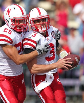 SEATTLE - SEPTEMBER 18:  Quarterback Taylor Martinez #3 of the Nebraska Cornhuskers celebrates with Kyler Reed #25 after scoring on an 80 yard touchdown run in the third quarter against the Washington Huskies on September 18, 2010 at Husky Stadium in Seat