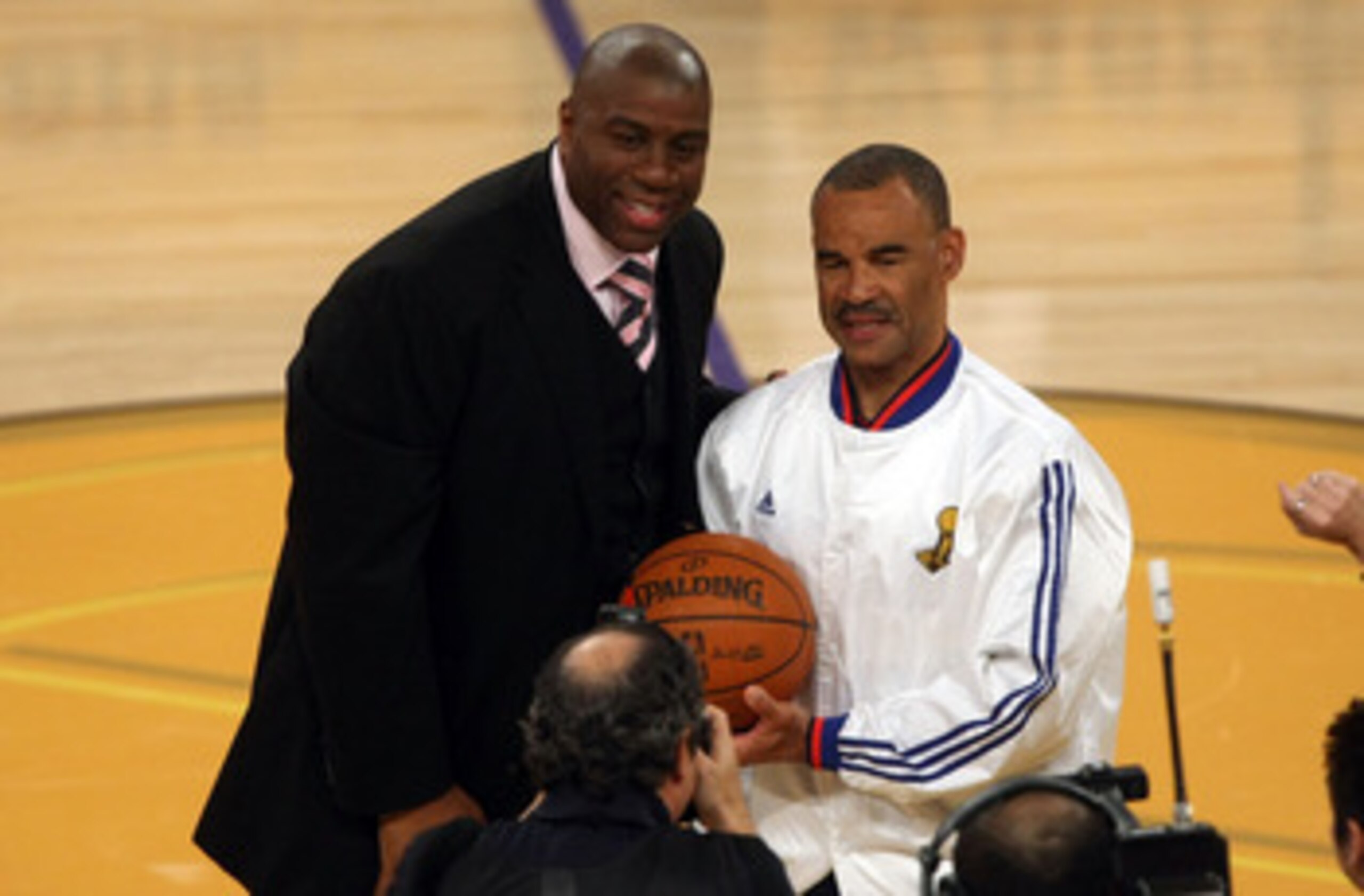 LOS ANGELES, CA - JUNE 04: NBA legend Magic Johnson presents the game ball to referee Dan Crawford before Game One of the 2009 NBA Finals between the Los Angeles Lakers and the Orlando Magic in at Staples Center on June 4, 2009 in Los Angeles, California LOS ANGELES, CA - JUNE 04: NBA legend Magic Johnson presents the game ball to referee Dan Crawford before Game One of the 2009 NBA Finals between the Los Angeles Lakers and the Orlando Magic in at Staples Center on June 4, 2009 in Los Angeles, California