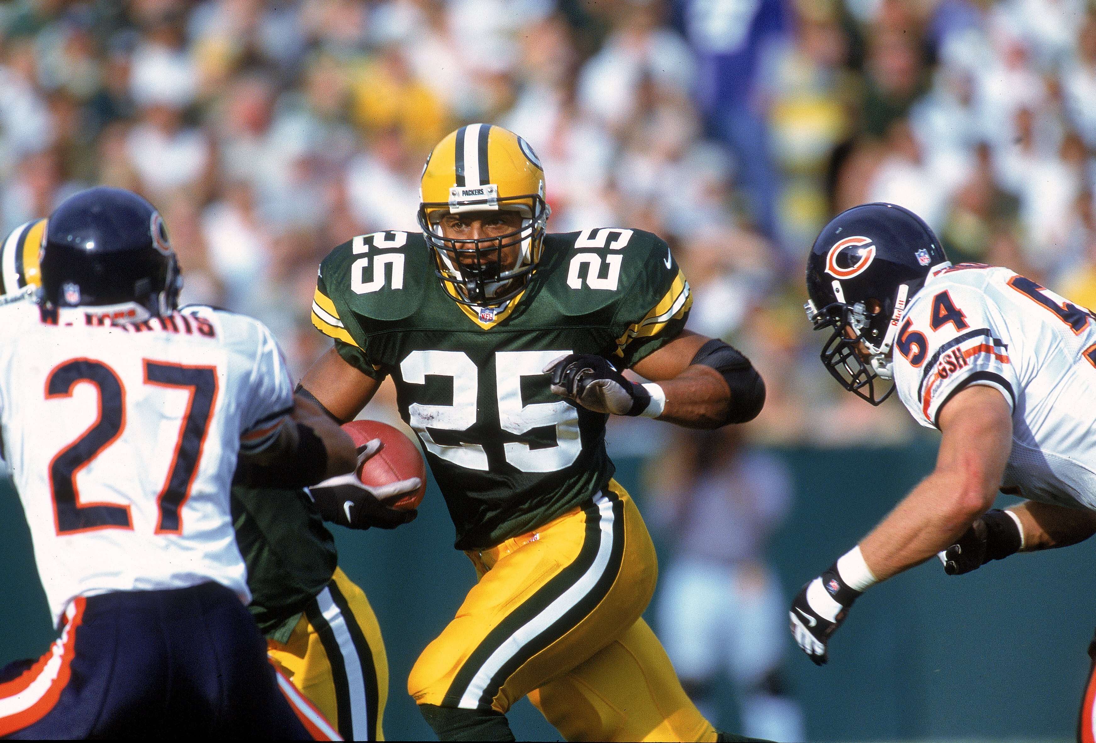 1 Oct 2000:  Dorsey Levens #25 of the Green Bay Packers carries the ball as he tries to avoid the tackle by Walt Harris #27 and Brian Urlacher #54 of the Chicago Bears at Lambeau Field in Green Bay, Wisconsin. The Bears defeated the Packers 27-24. Mandato