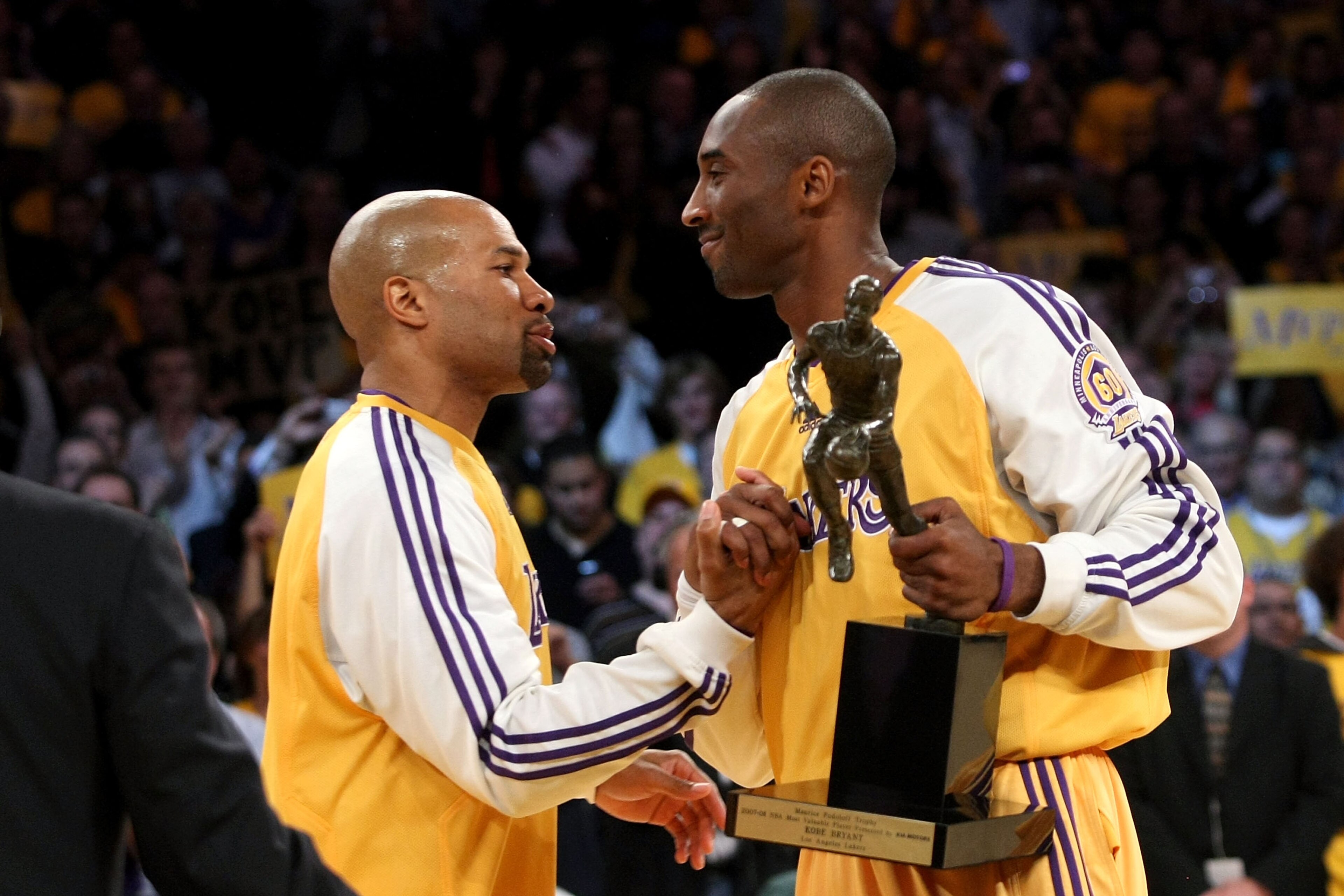 LOS ANGELES, CA - MAY 07: Derek Fisher #2 congratulates teammate Kobe Bryant #24 of the Los Angeles Lakers after Bryant was presented with the MVP trophy before Game Two of the Western Conference Semifinals against the Utah Jazz during the 2008 NBA Playo LOS ANGELES, CA - MAY 07: Derek Fisher #2 congratulates teammate Kobe Bryant #24 of the Los Angeles Lakers after Bryant was presented with the MVP trophy before Game Two of the Western Conference Semifinals against the Utah Jazz during the 2008 NBA Playo
