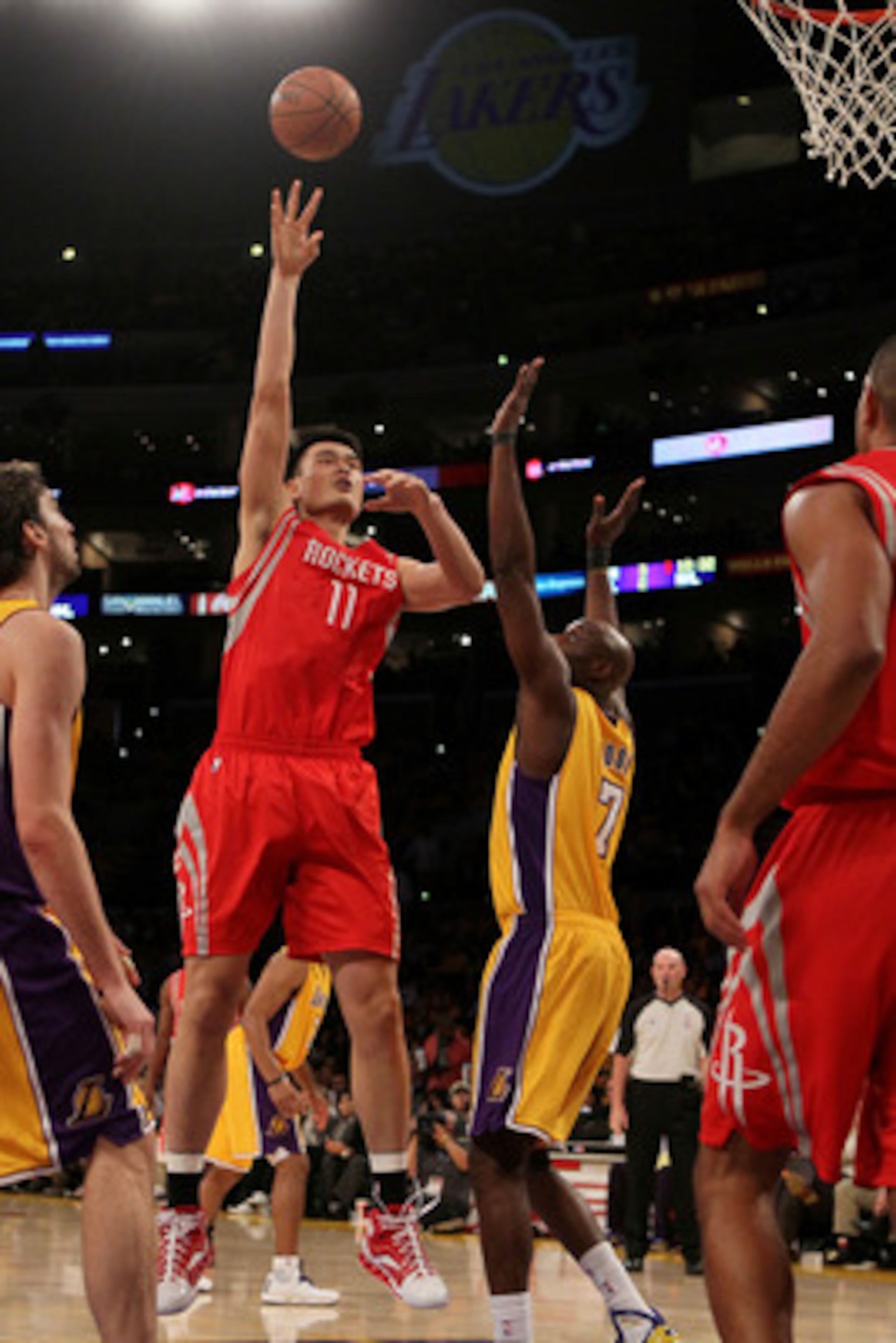 LOS ANGELES, CA - OCTOBER 26: Yao Ming #11 of the Houston Rockets takes a shot against the Los Angeles Lakers during their game at Staples Center on October 26, 2010 in Los Angeles, California. NOTE TO USER: User expressly acknowledges and agrees that, b LOS ANGELES, CA - OCTOBER 26: Yao Ming #11 of the Houston Rockets takes a shot against the Los Angeles Lakers during their game at Staples Center on October 26, 2010 in Los Angeles, California. NOTE TO USER: User expressly acknowledges and agrees that, b